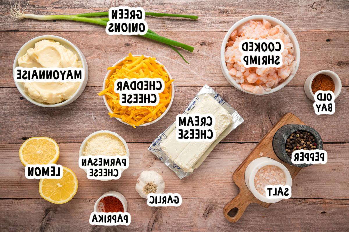 Salsa di Gamberetti Calda a Lenta Cottura 3 ingredients for slow cooker hot shrimp dip on a table.
