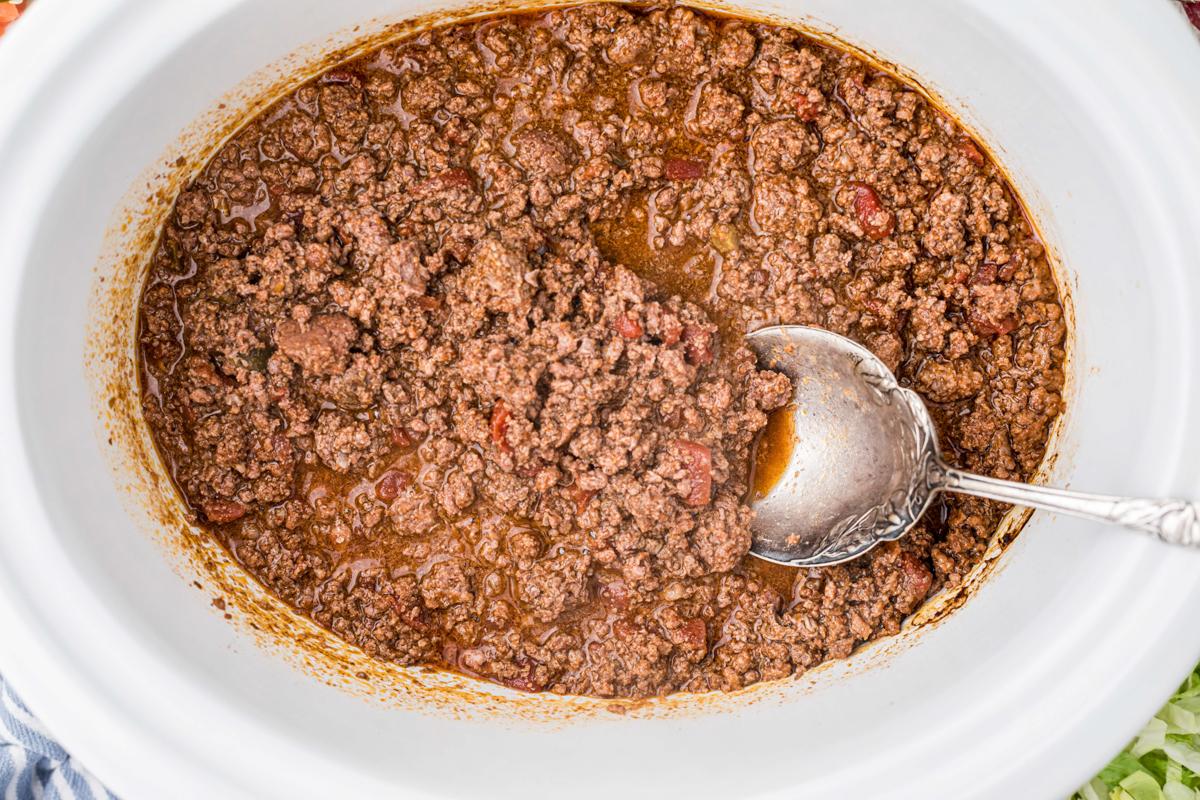 Tacos di Cervo a Cottura Lenta 5 overhead shot of venison taco meat with a spoon in it.