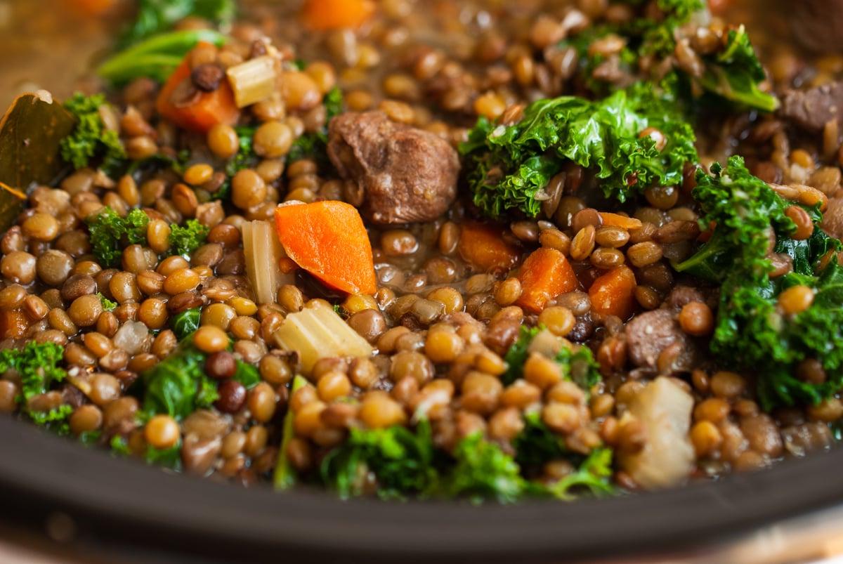 close-up of slow cooker beef and lentil soup.
