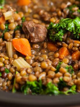 close-up of slow cooker beef and lentil soup.
