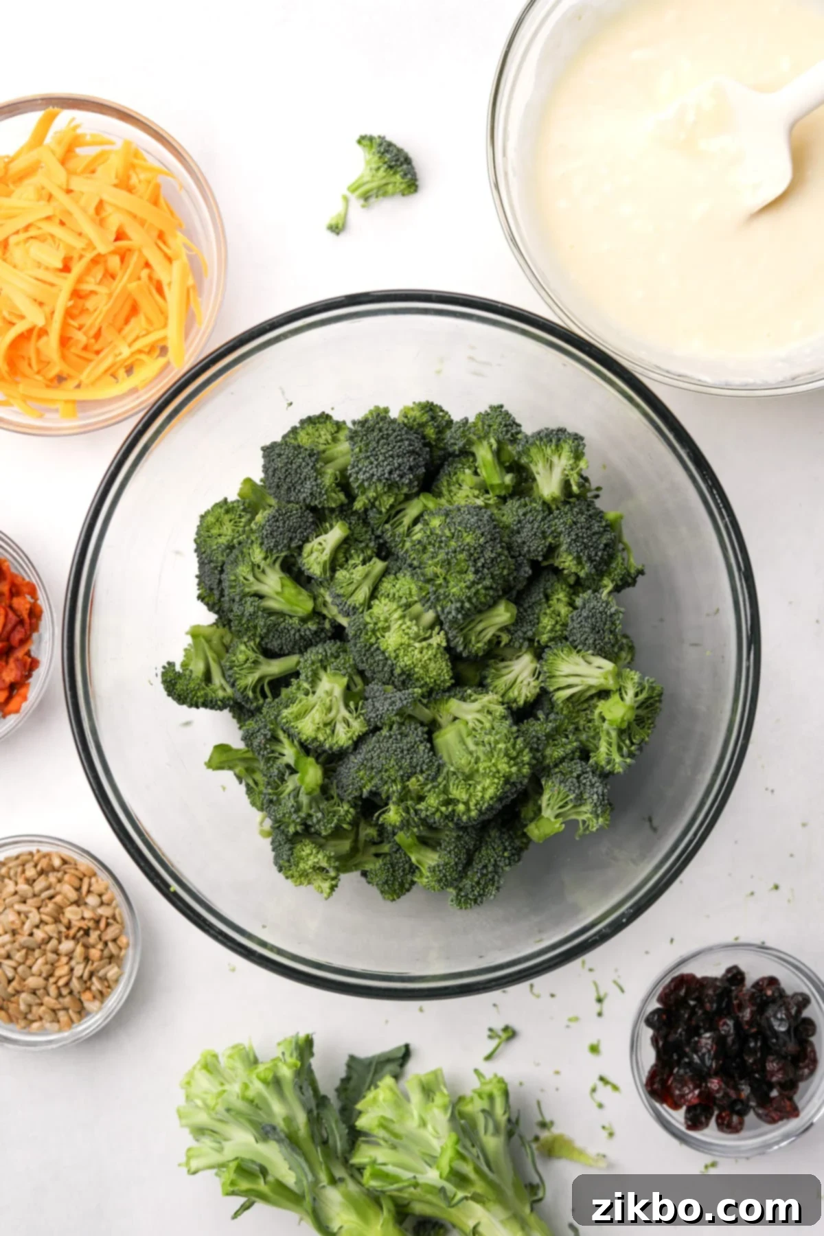 Crunchy Broccoli Delight 6 A large bowl of fresh, raw broccoli florets, perfectly cut for broccoli salad.