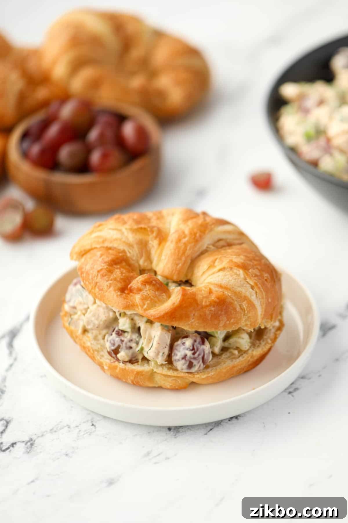 Refreshing Chicken and Grape Salad 6 A croissant sliced in half and filled with chicken salad.