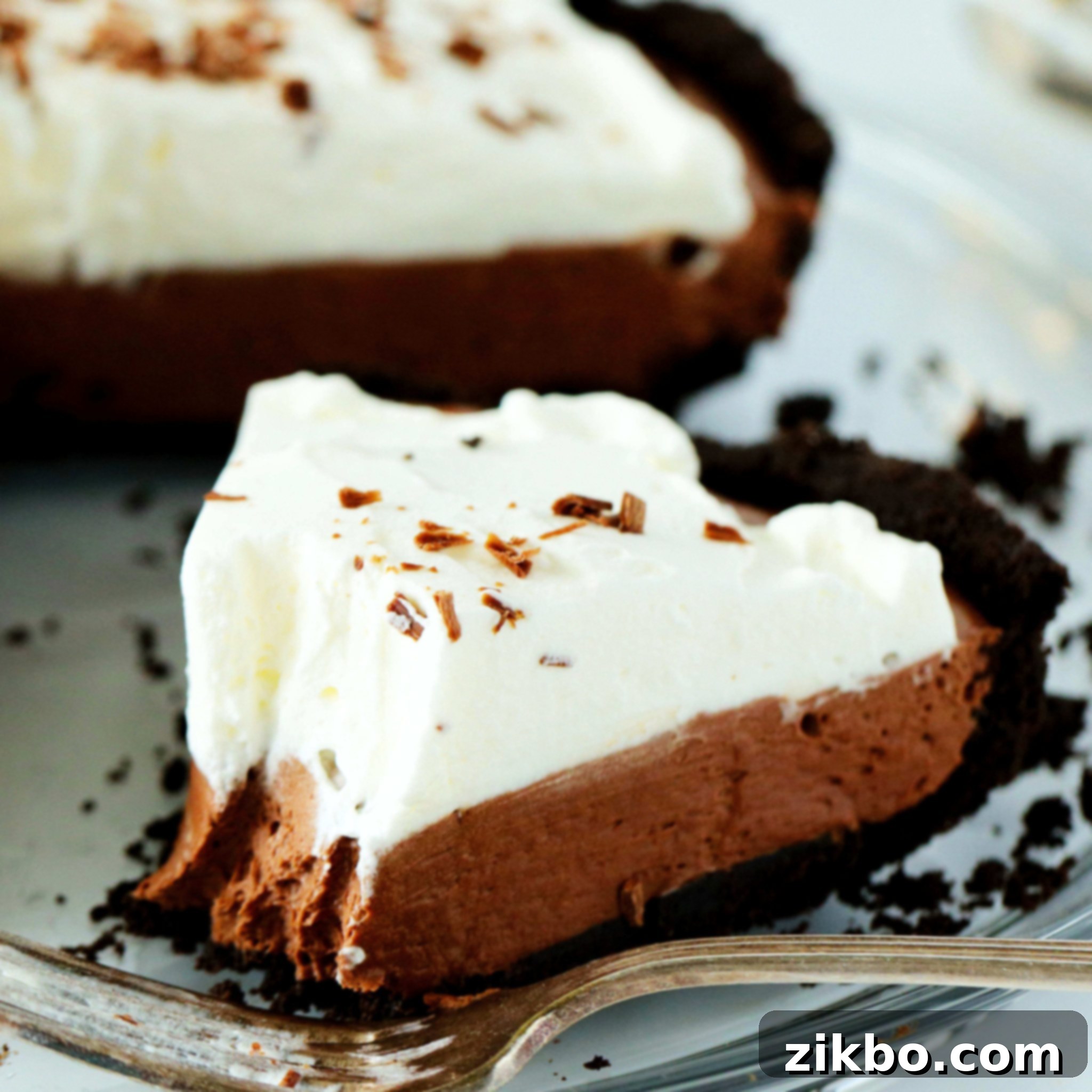 Rich and creamy no-bake chocolate pie with Oreo crust and whipped cream topping
