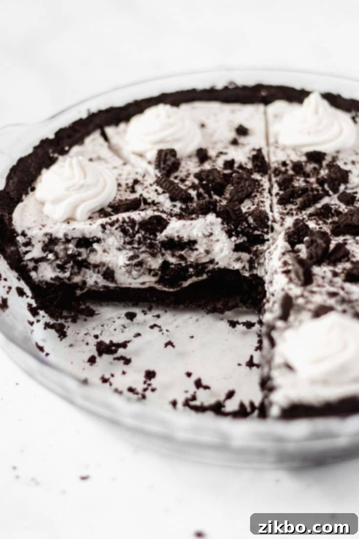 Intense no-bake Cookies and Cream pie with multiple layers of Oreo cookies