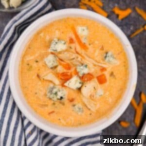 Bold Buffalo Chicken Soup 9 A bowl of buffalo chicken soup topped with blue cheese crumbles.