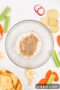 A bowl with a dry mix and sour cream in it, ready for mixing.