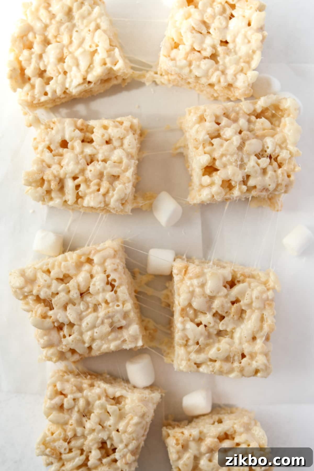 Your Little Krispie Fix 5 Mini rice krispies treats with mini marshmallows all around them.