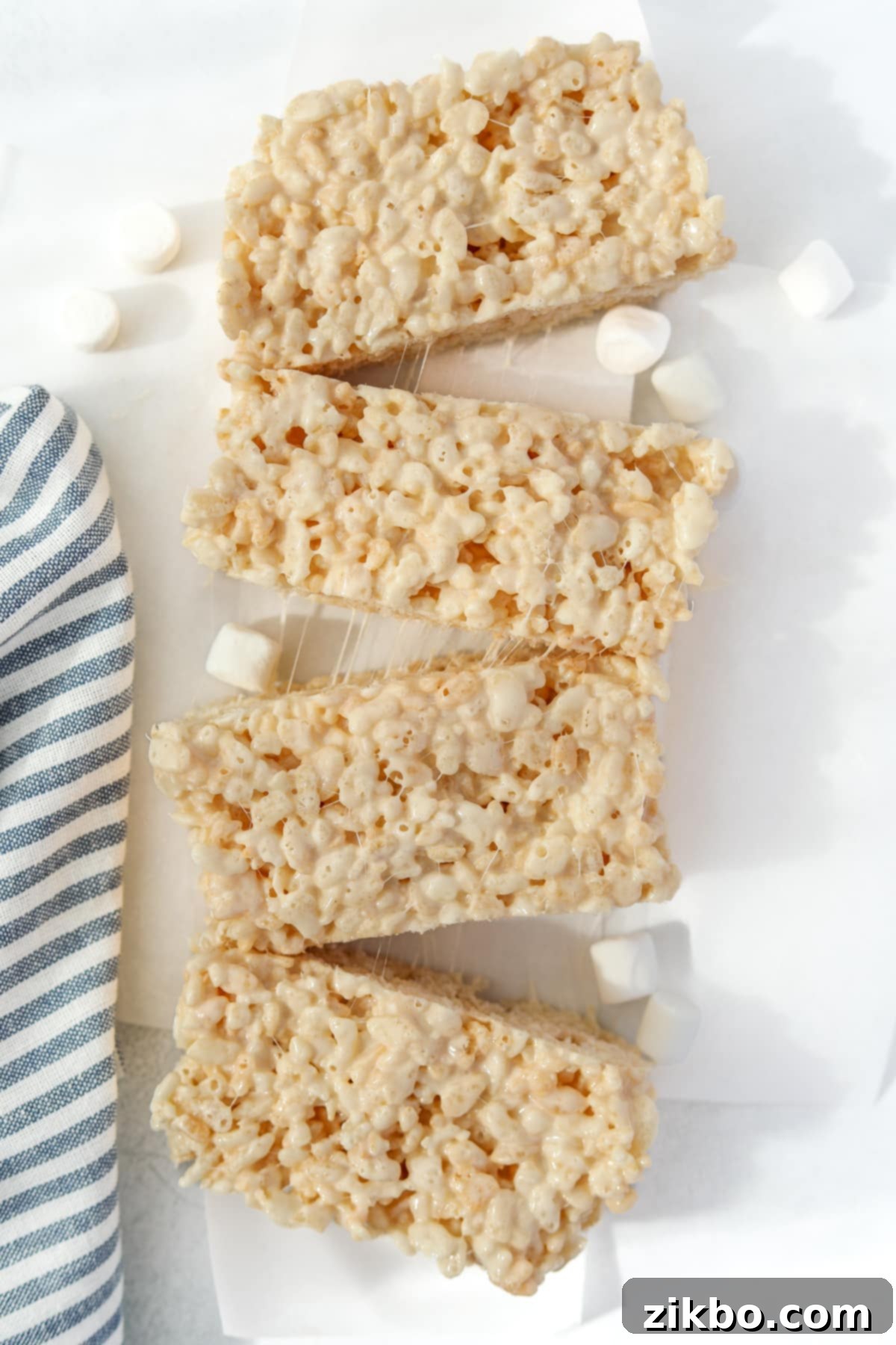 Your Little Krispie Fix 7 Four large rice krispie treats that were made in a loaf pan.