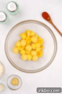 Egg yolks in a large bowl.