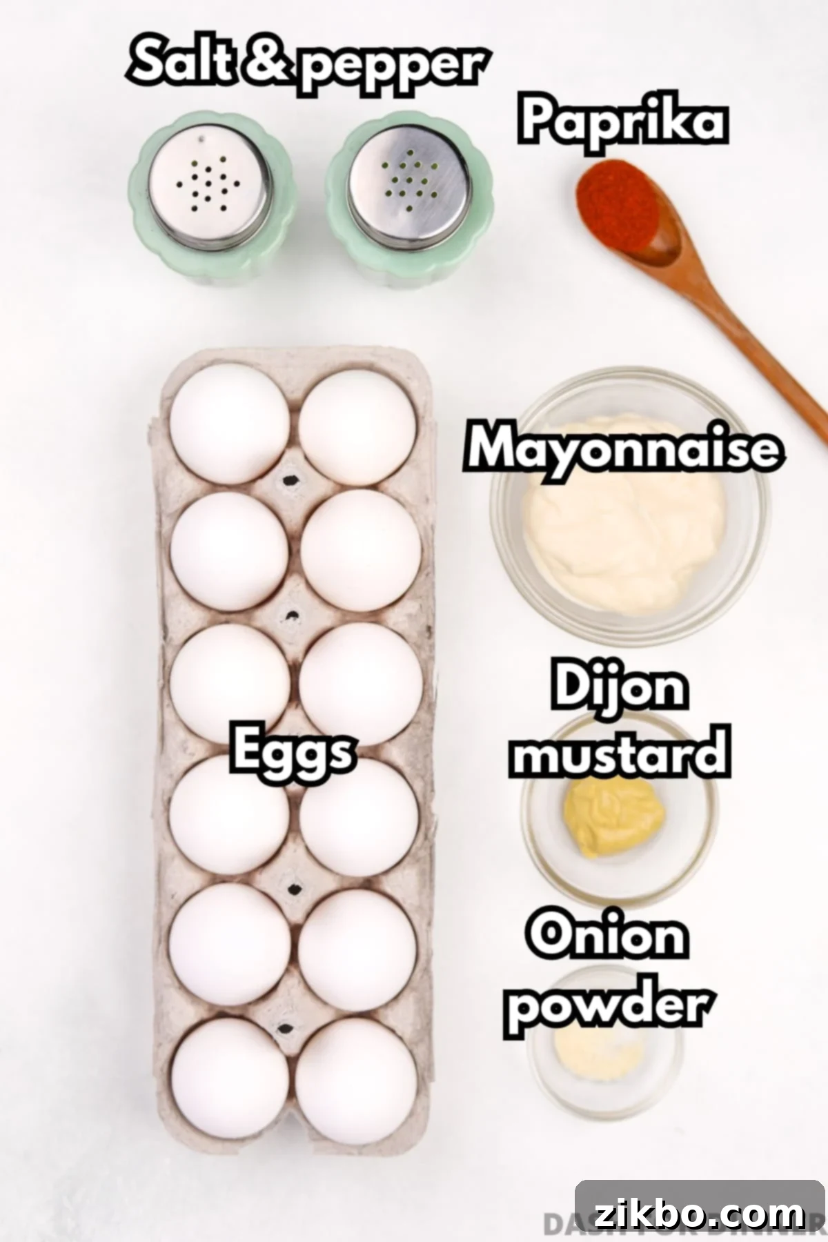 The ingredients needed to make deviled eggs, including mayo, dijon mustard, salt, pepper, and paprika.