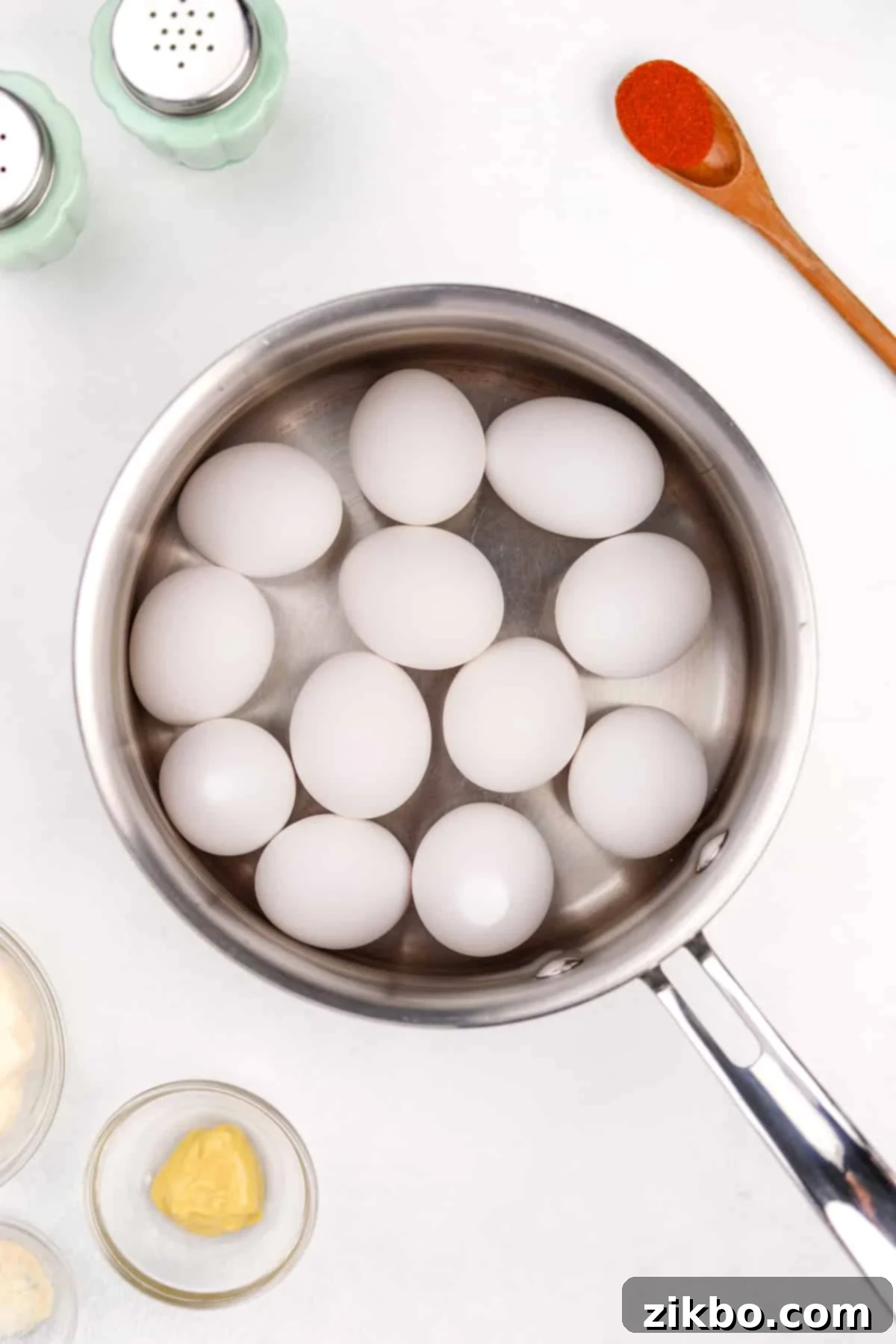 A pot of water with eggs inside.