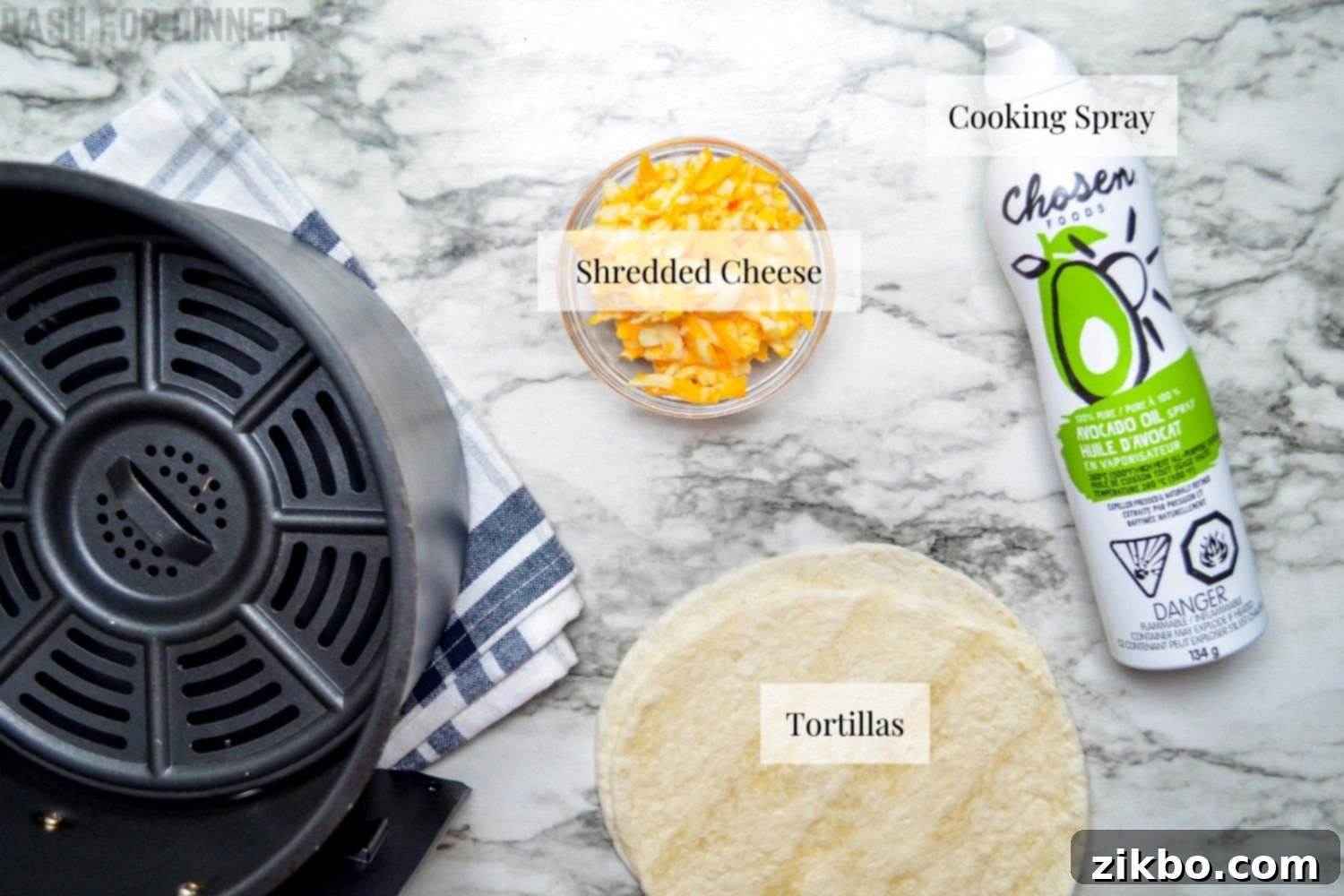 The simple ingredients needed for air fryer quesadillas: tortillas, shredded cheese, and cooking spray.
