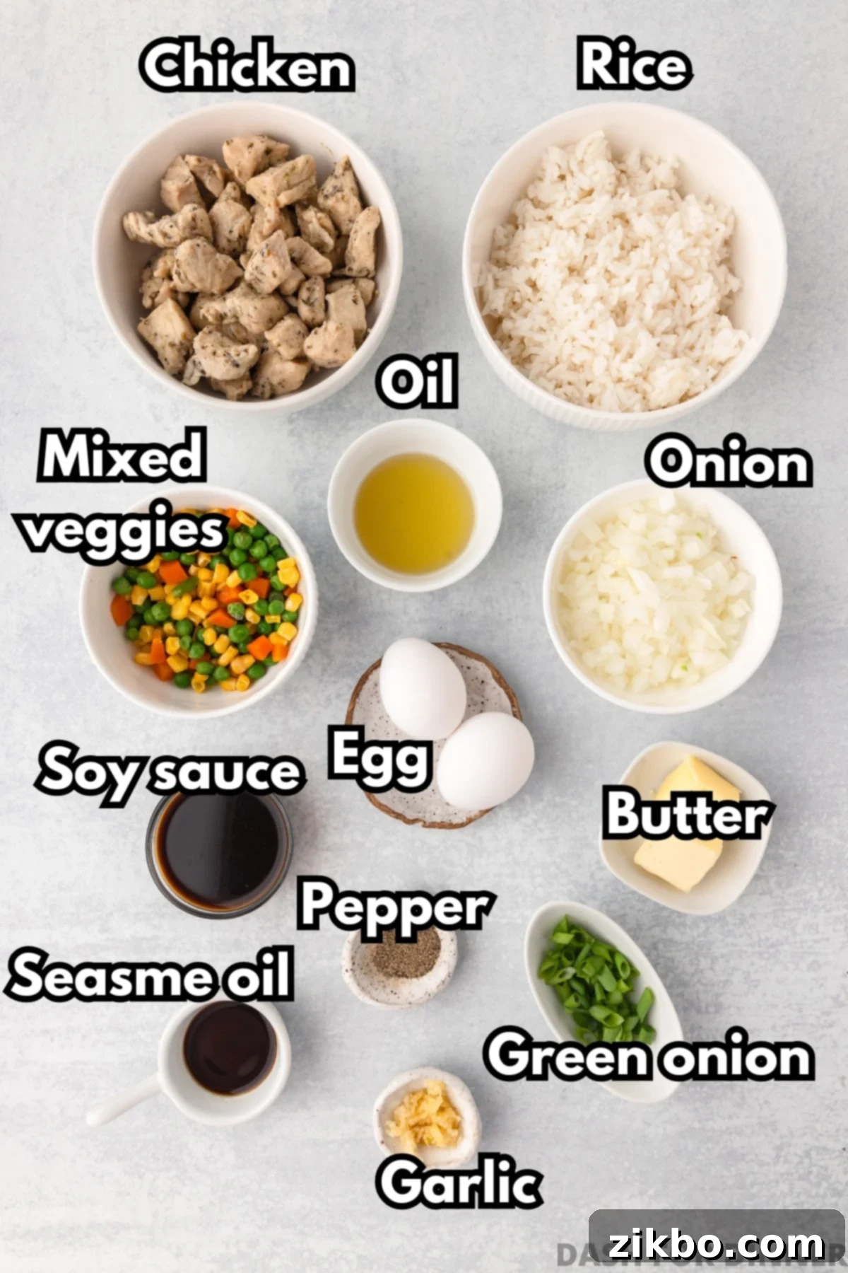 Signature Benihana Chicken Fried Rice 3 The ingredients needed to make chicken fried rice: bowls of rice, chicken, eggs, butter, etc.