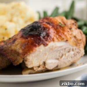 A close up on a piece of chicken, showing the juicy meat.