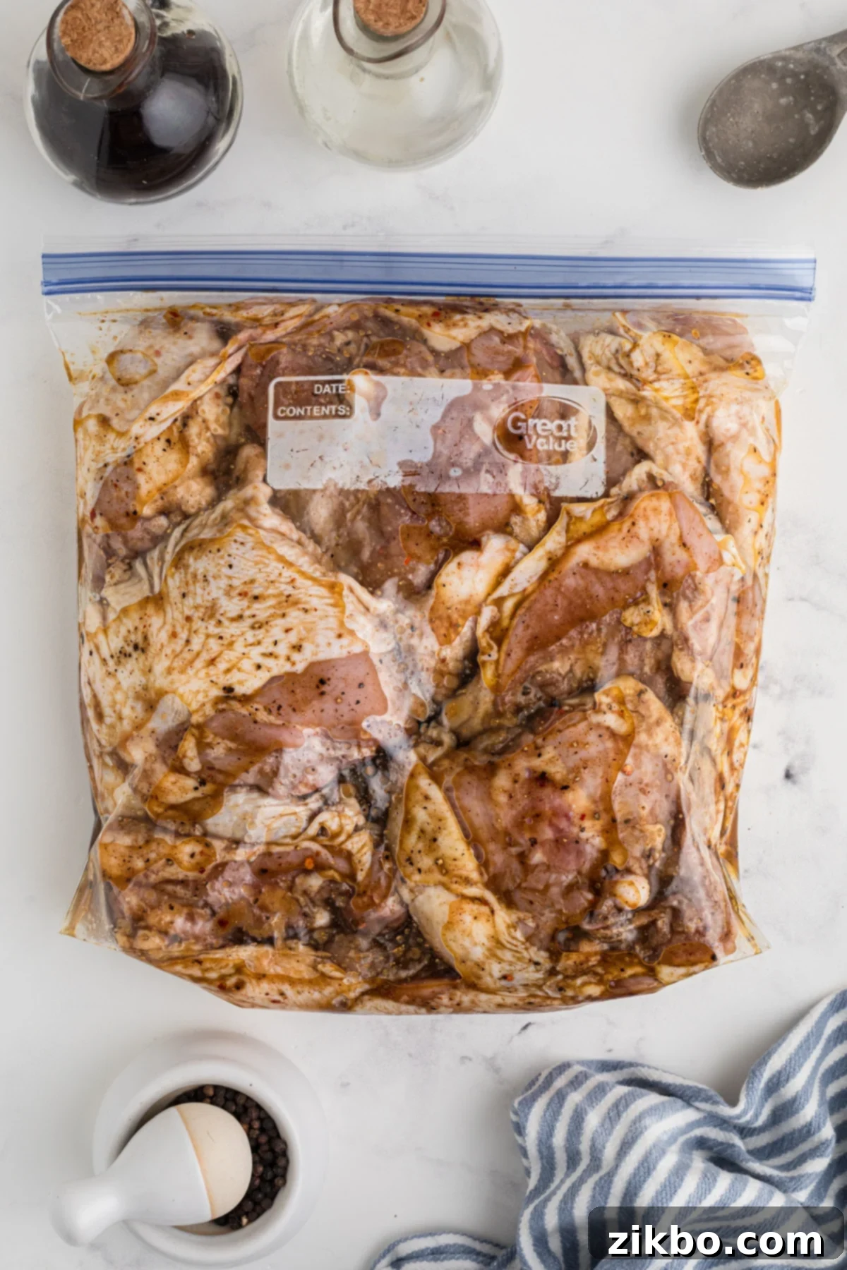 Step 2: Gently adding chicken thighs to the marinade in a freezer bag, ensuring even coating.