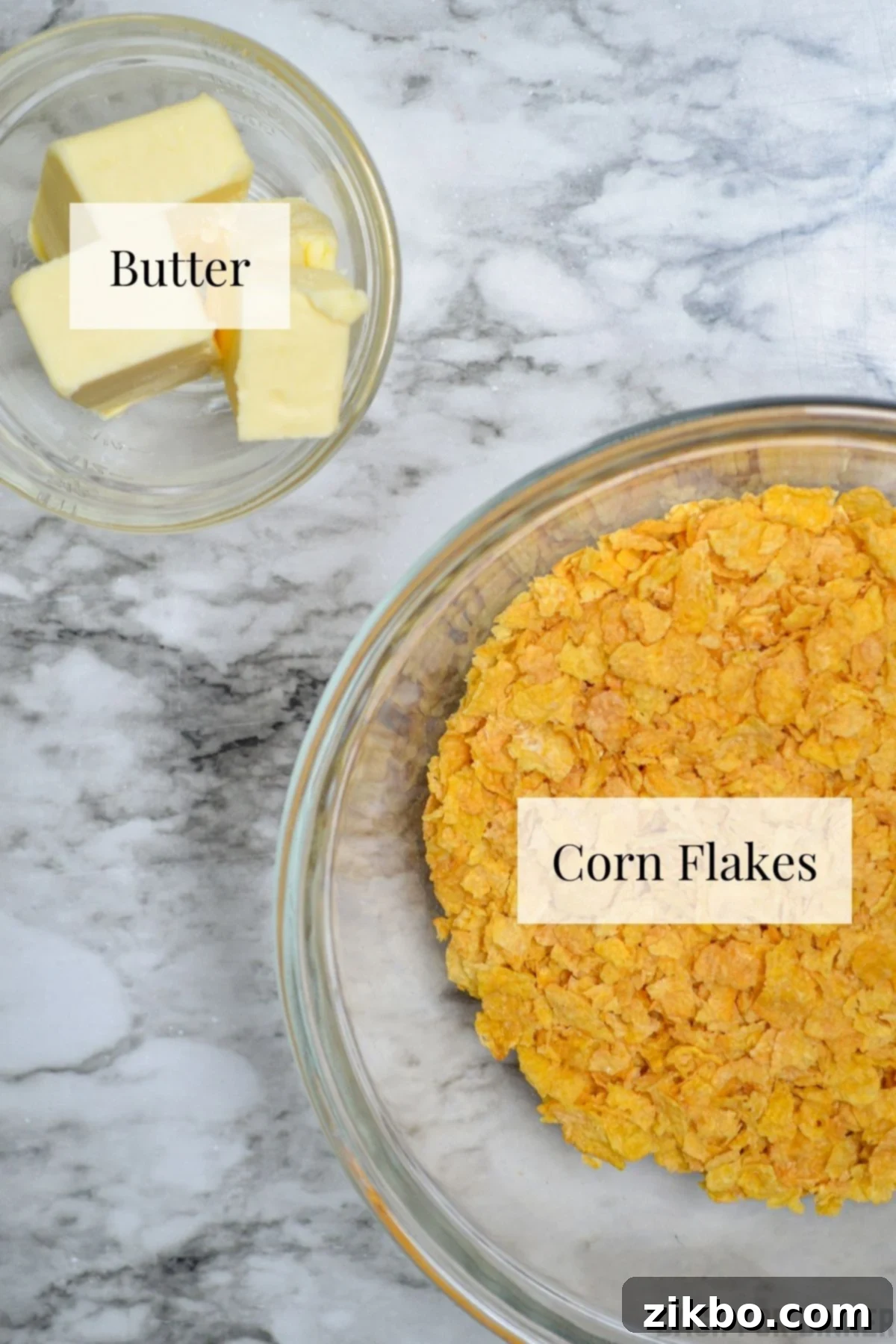 Slow Cooker Golden Cheesy Hash Brown Casserole 7 Simple ingredients for the crispy casserole topping: a bowl of crushed corn flakes cereal and a measuring cup of melted butter.