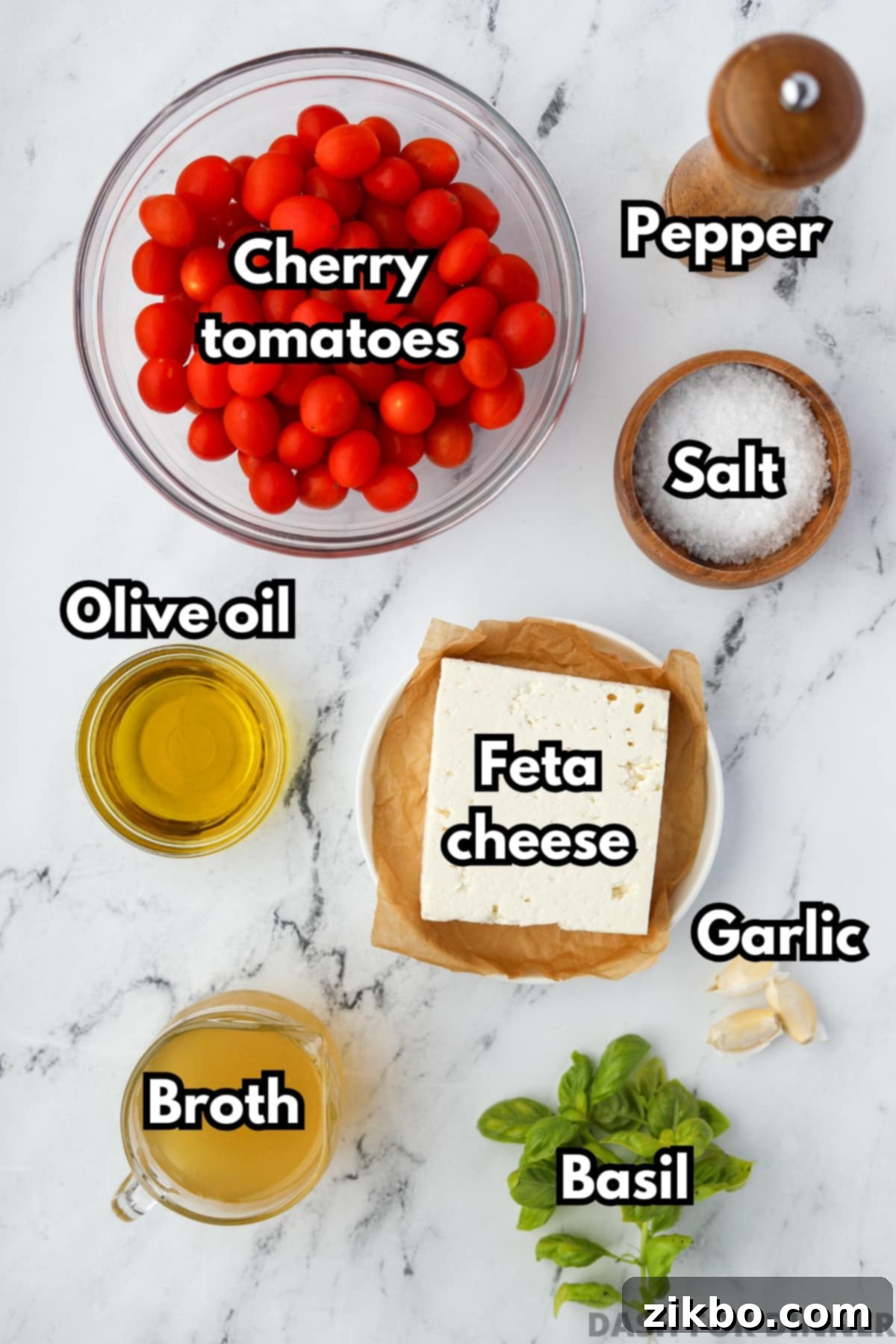 The ingredients needed to make roasted tomato and feta soup: cherry tomatoes, feta, olive oil, basil, etc. 