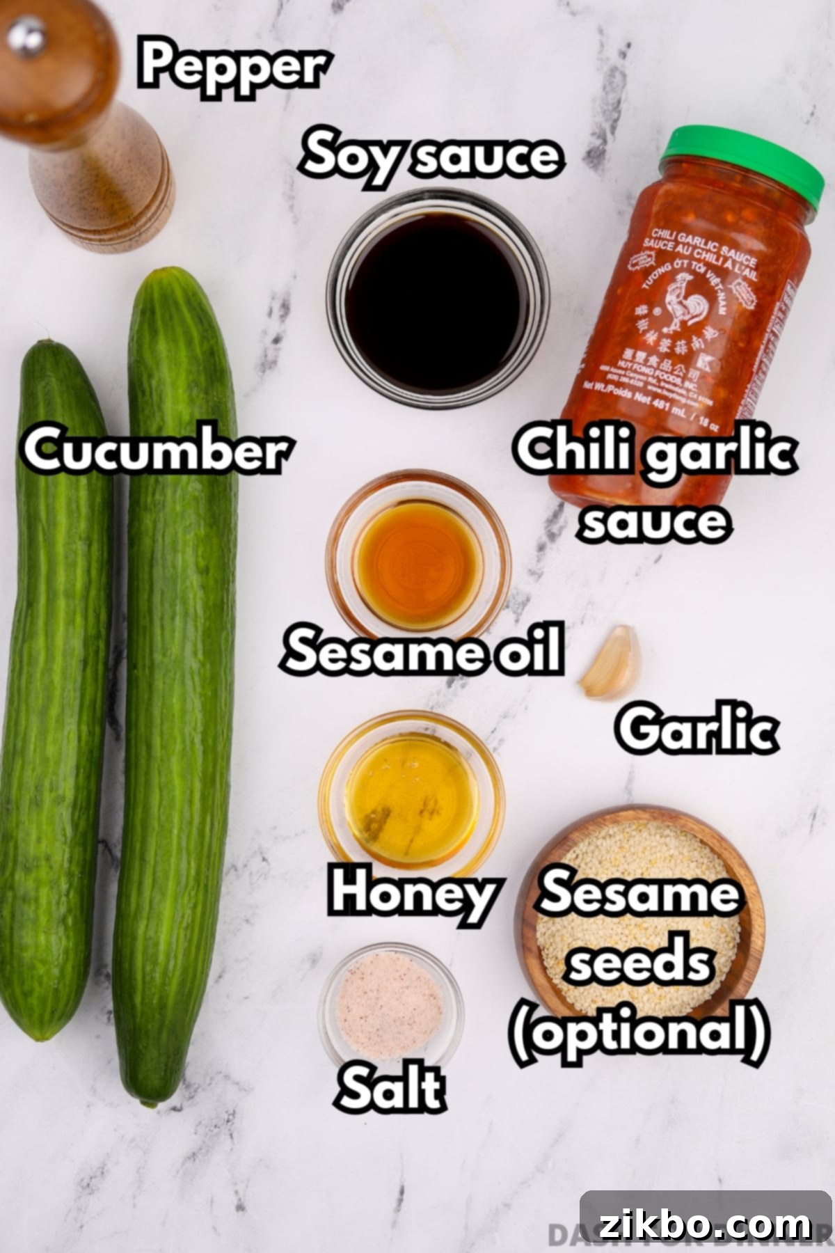 Fiery Fresh Cucumber Crunch 3 The vibrant ingredients needed to prepare a delicious Asian-inspired spicy cucumber salad, including fresh cucumbers, soy sauce, honey, chili garlic sauce, and sesame oil.