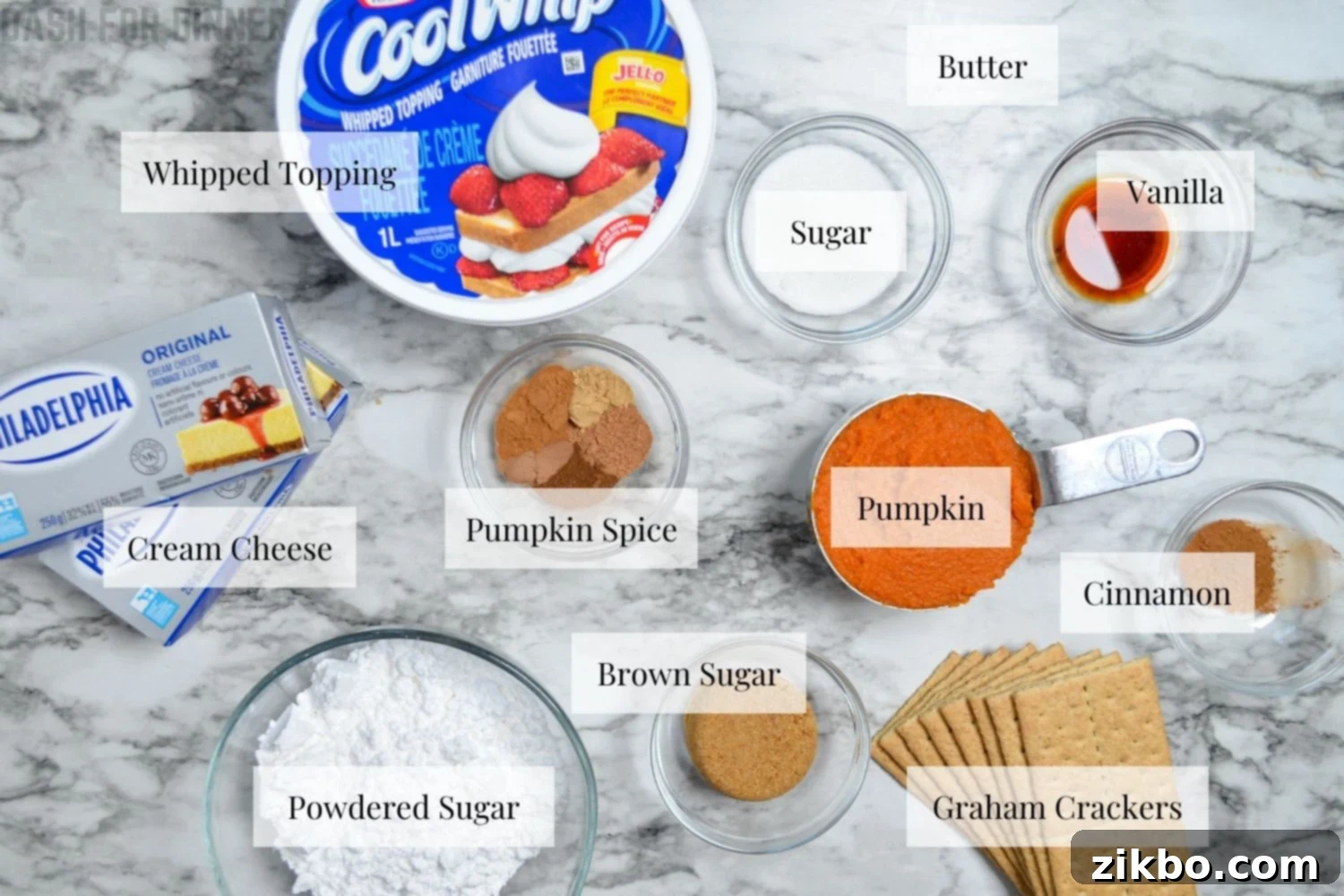 The ingredients needed to make no bake pumpkin cheesecake bars, neatly arranged on a counter.