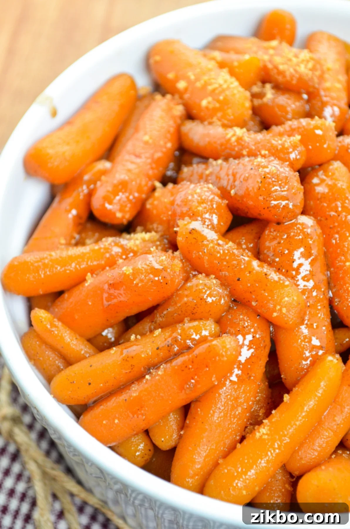A serving dish full of maple glazed carrots.