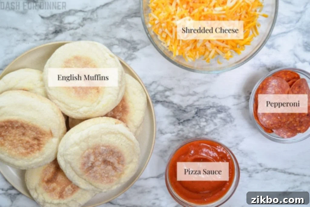 The ingredients needed to make air fryer english muffin pizzas.