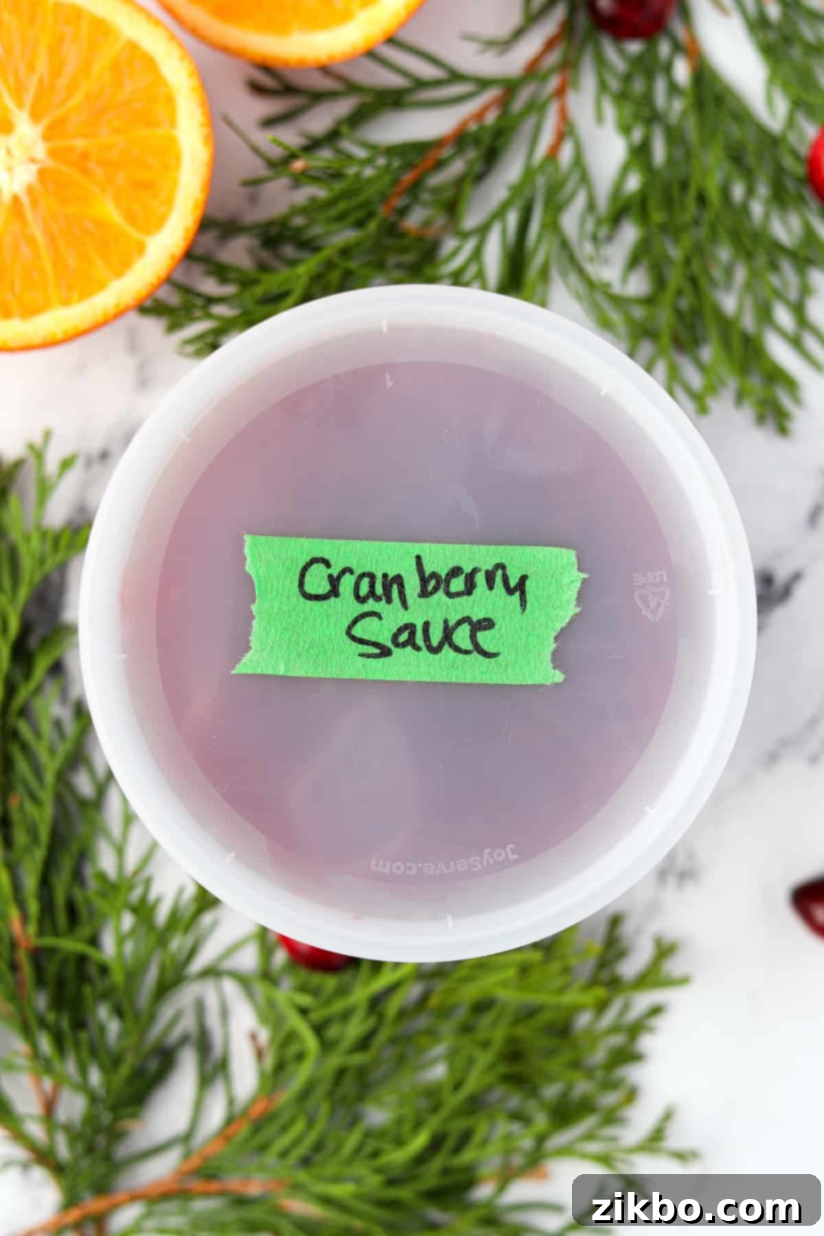 Cranberry Sauce From Scratch 6 A deli container labeled "cranberry sauce", containing homemade cranberry sauce.
