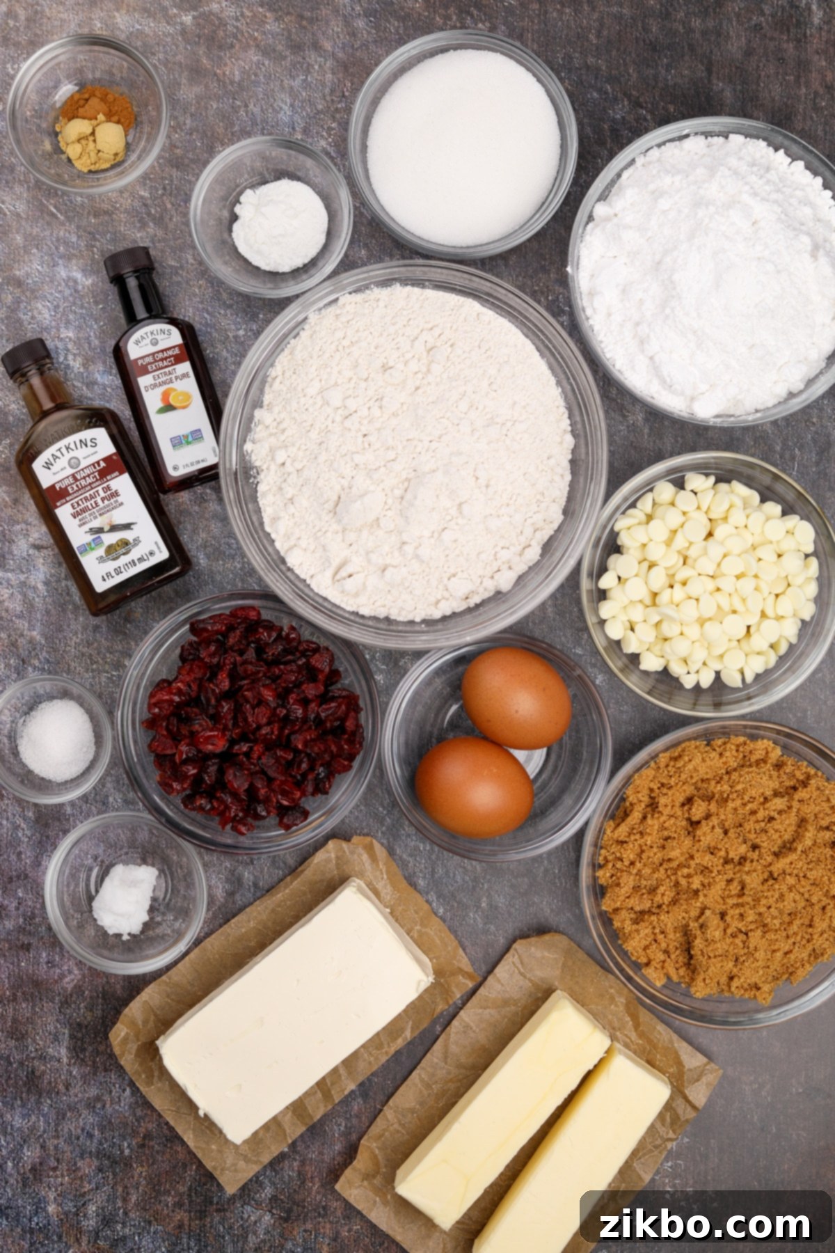 Heavenly Cranberry Bars 3 The ingredients needed to make homemade cranberry bliss bars, including flour, butter, cream cheese, eggs, and sugar.