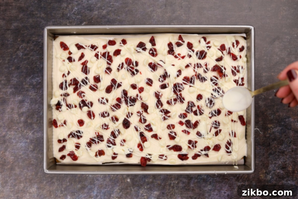 Heavenly Cranberry Bars 7 Drizzling white chocolate over cream cheese frosting and dried cranberries.