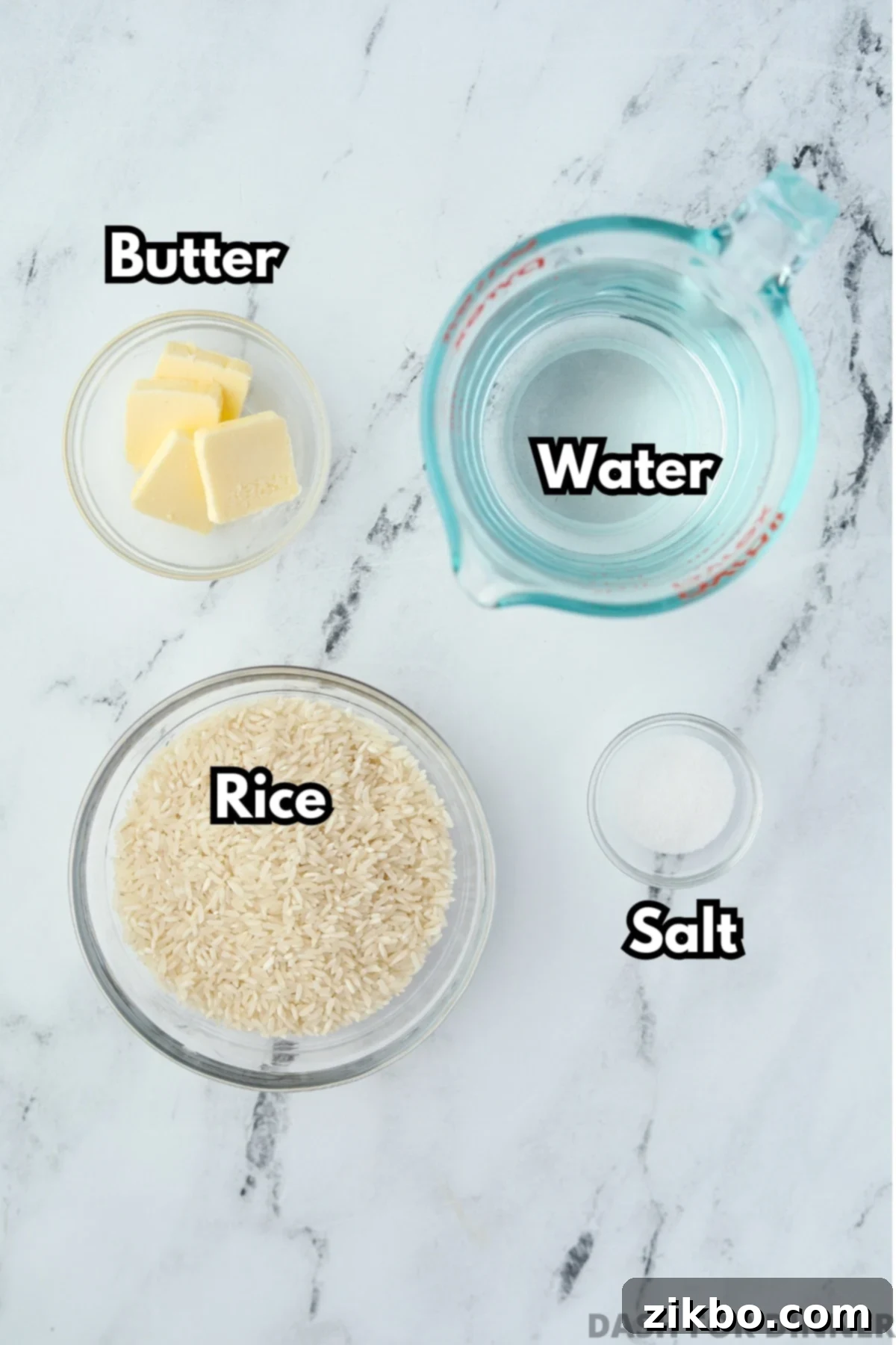 Golden Baked Rice 3 The simple ingredients needed to make perfect baked rice: boiling water, softened butter, fine salt, and uncooked long-grain white rice.