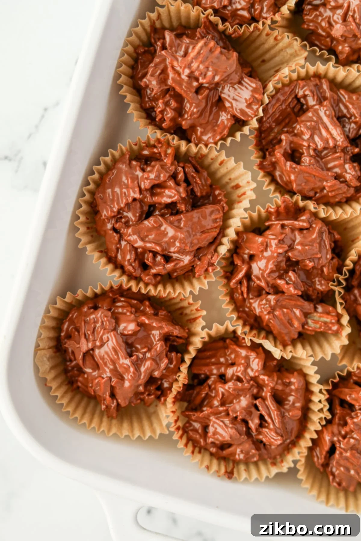 Chocolate and potato chip clusters in muffin liners, showcasing their sweet and salty appeal.