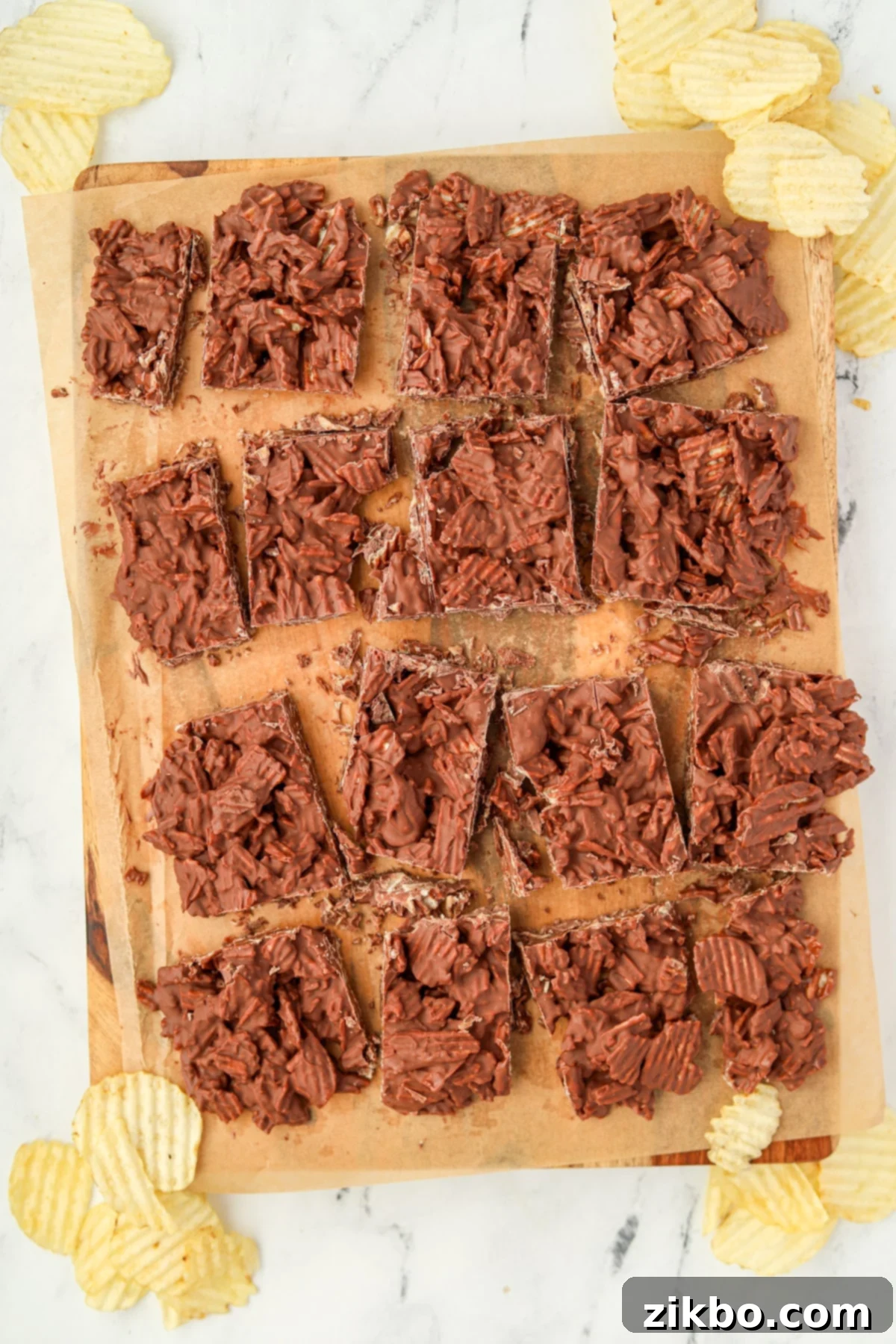 Chocolate potato chip bark divided into 16 squares, perfectly portioned for sharing or gifting.