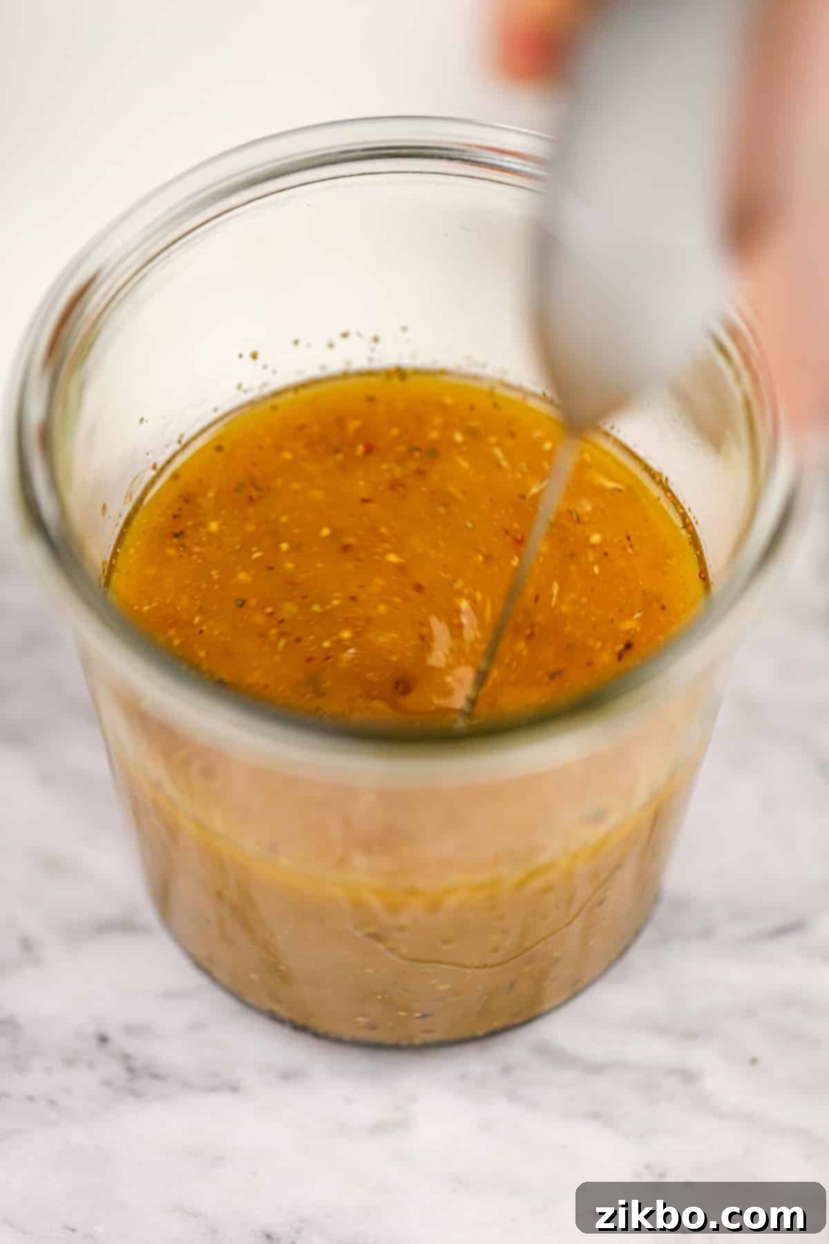 A small frothing want emulsifying a homemade dressing.