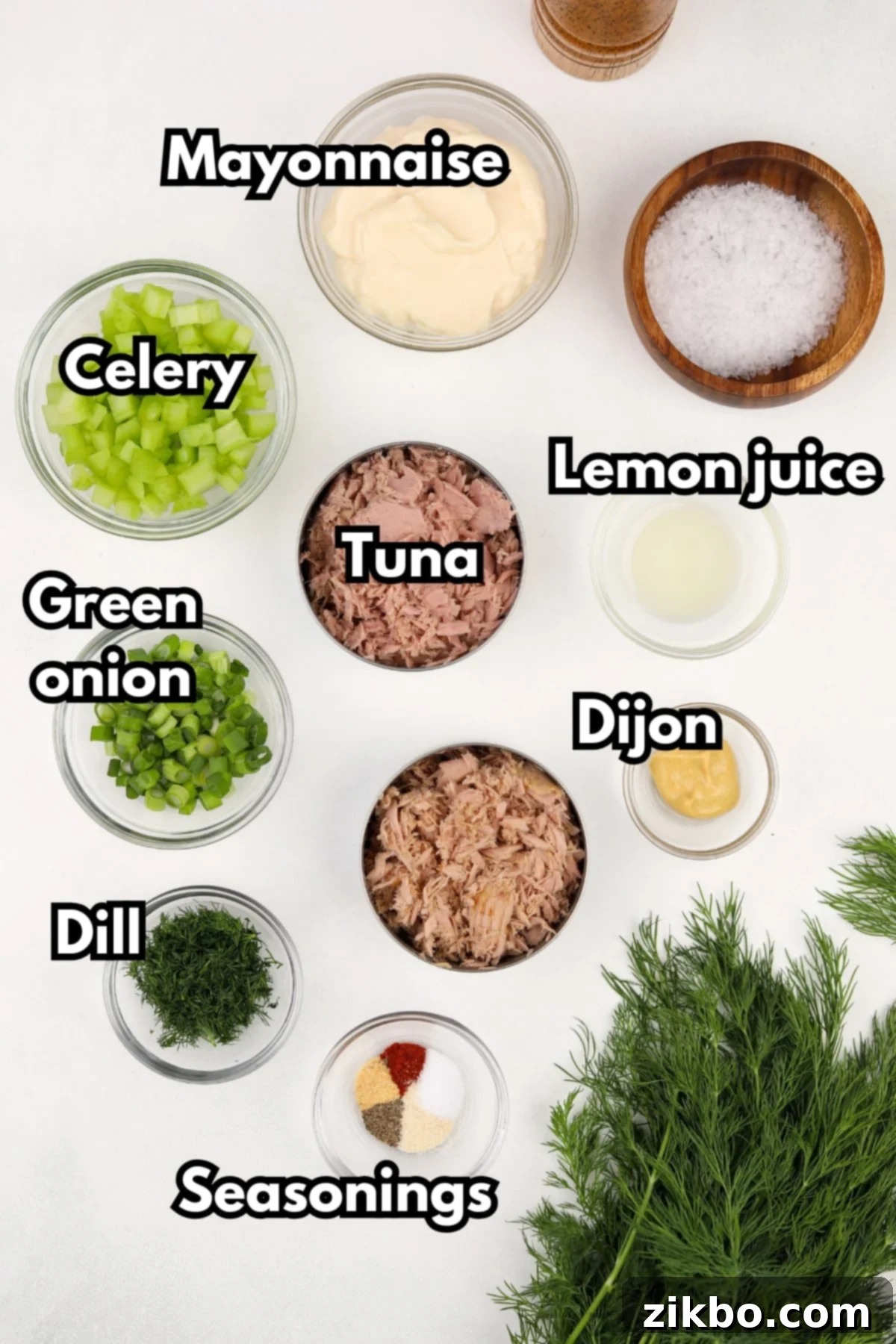 Bright Dill Tuna Salad 3 The essential ingredients laid out for making the best tuna salad: canned tuna, mayonnaise, fresh dill, green onions, celery, Dijon mustard, lemon juice, and seasonings.