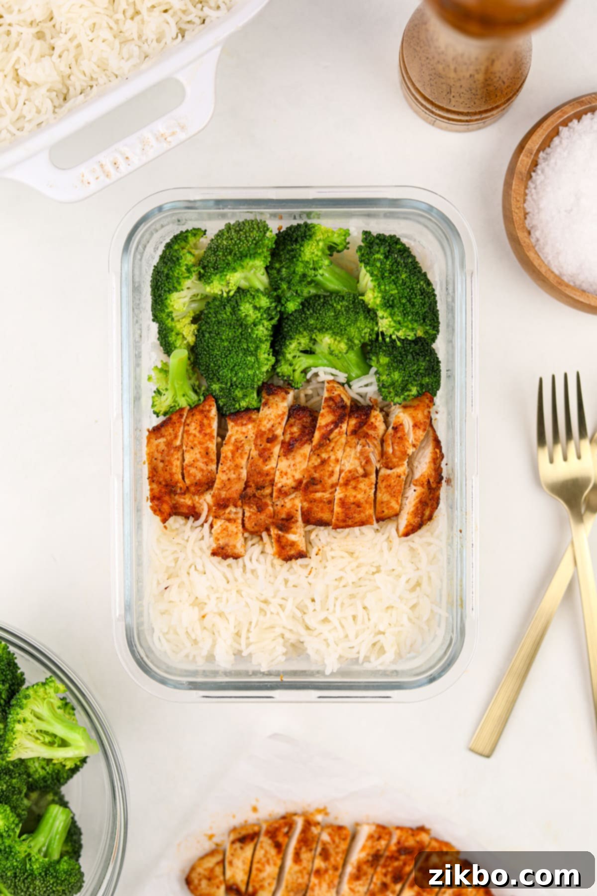 A meal prep container filled with rice, chicken, and broccoli.