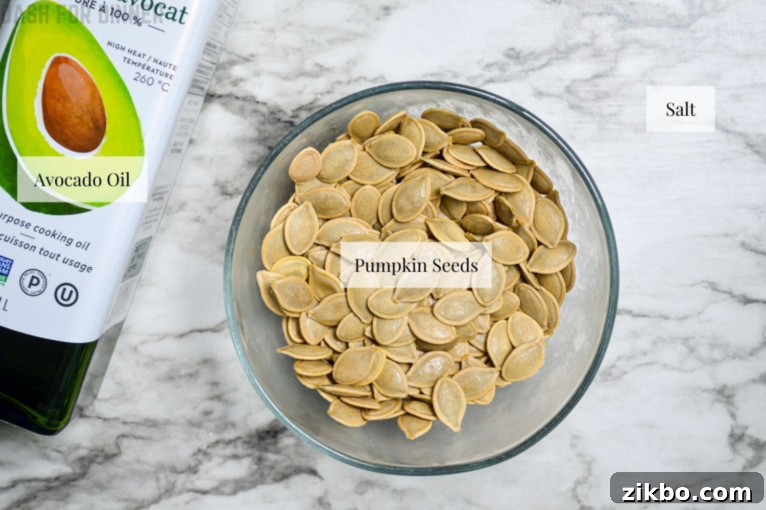 The simple ingredients needed to roast pumpkin seeds: salt, cleaned pumpkin seeds, and avocado oil.