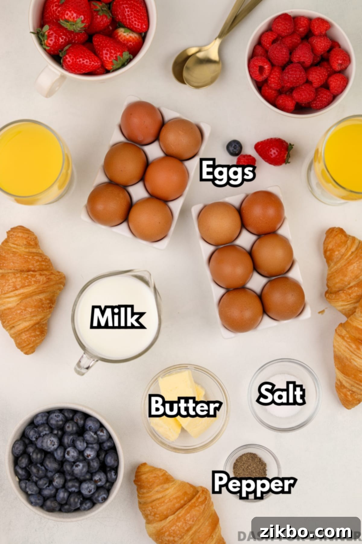 The ingredients needed to make baked scrambled eggs: milk, butter, salt, pepper, and eggs.