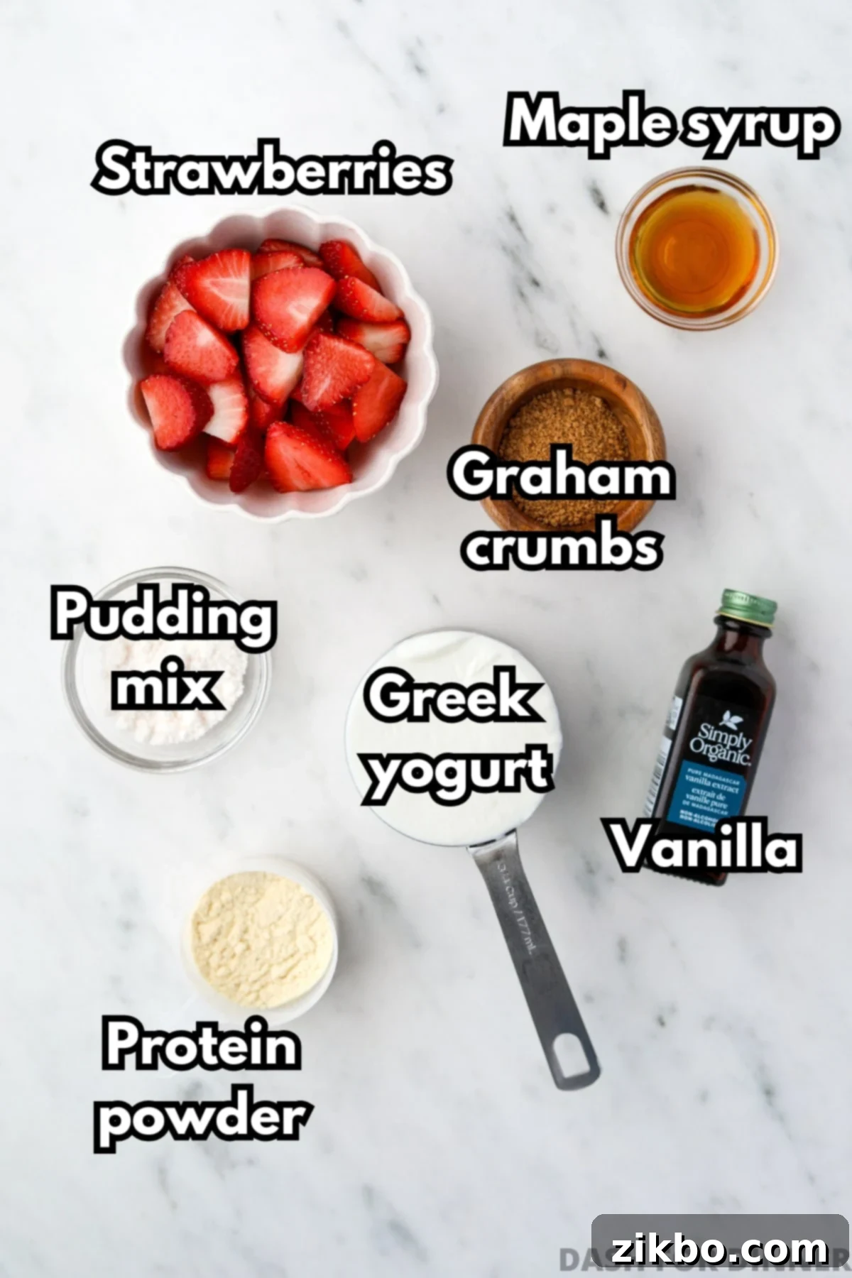 A bowl of sliced strawberries, some greek yogurt, maple syrup, and several other ingredients.