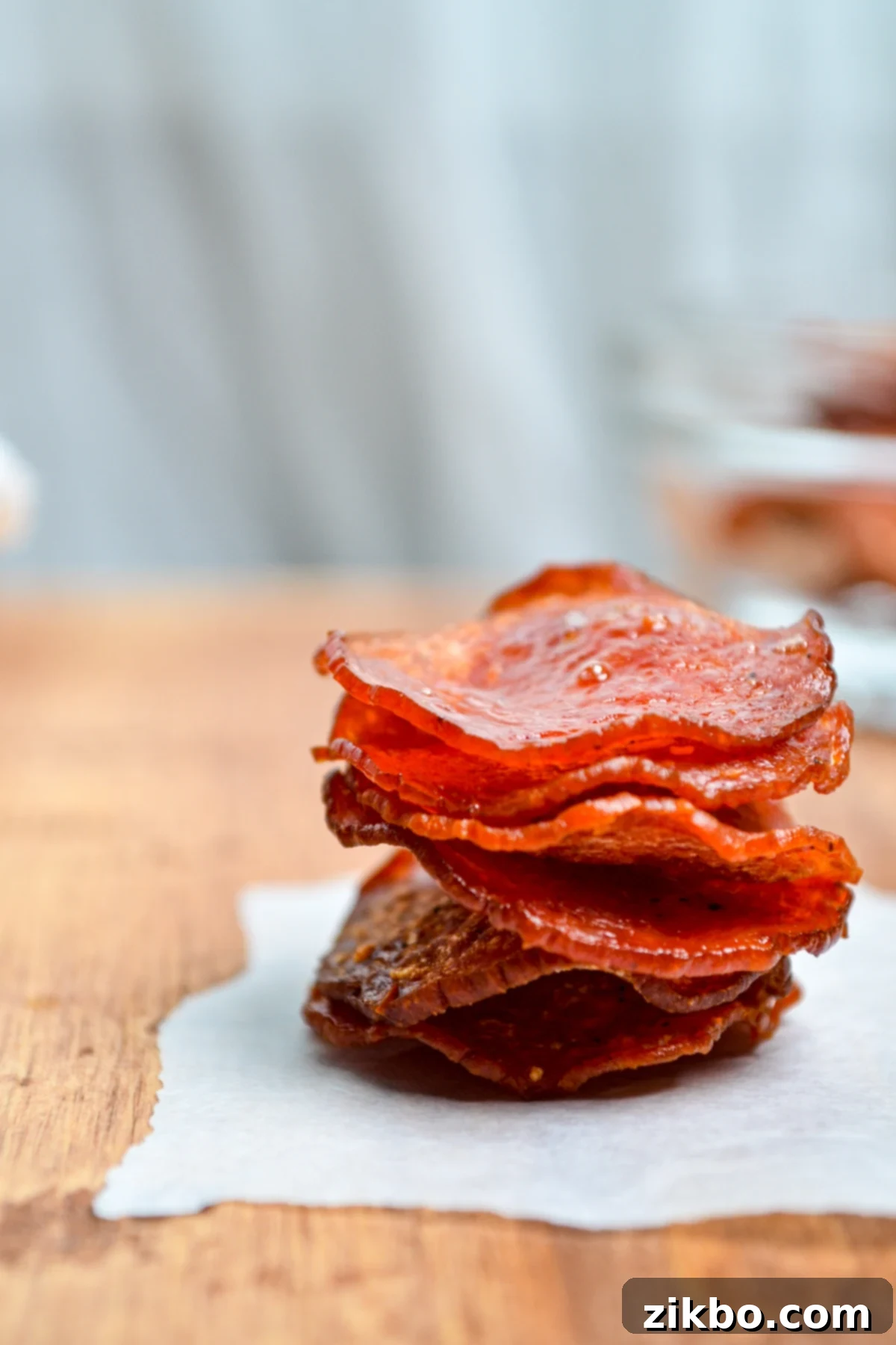 Air fryer pepperoni chips stacked in a tower.