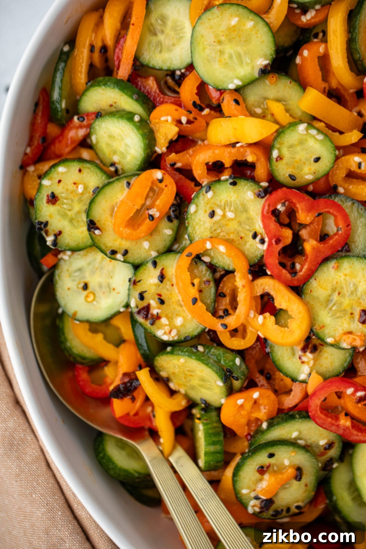 Fresh Cucumber & Bell Pepper Salad 7 A salad bowl filled with sliced bell pepper and cucumber.