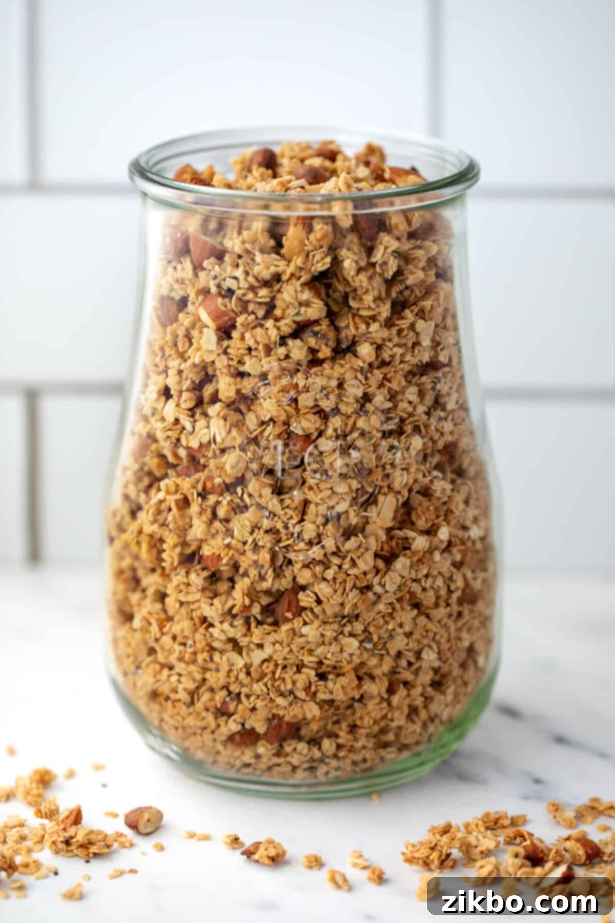 A large Weck jar elegantly filled with homemade granola, ready for storage.
