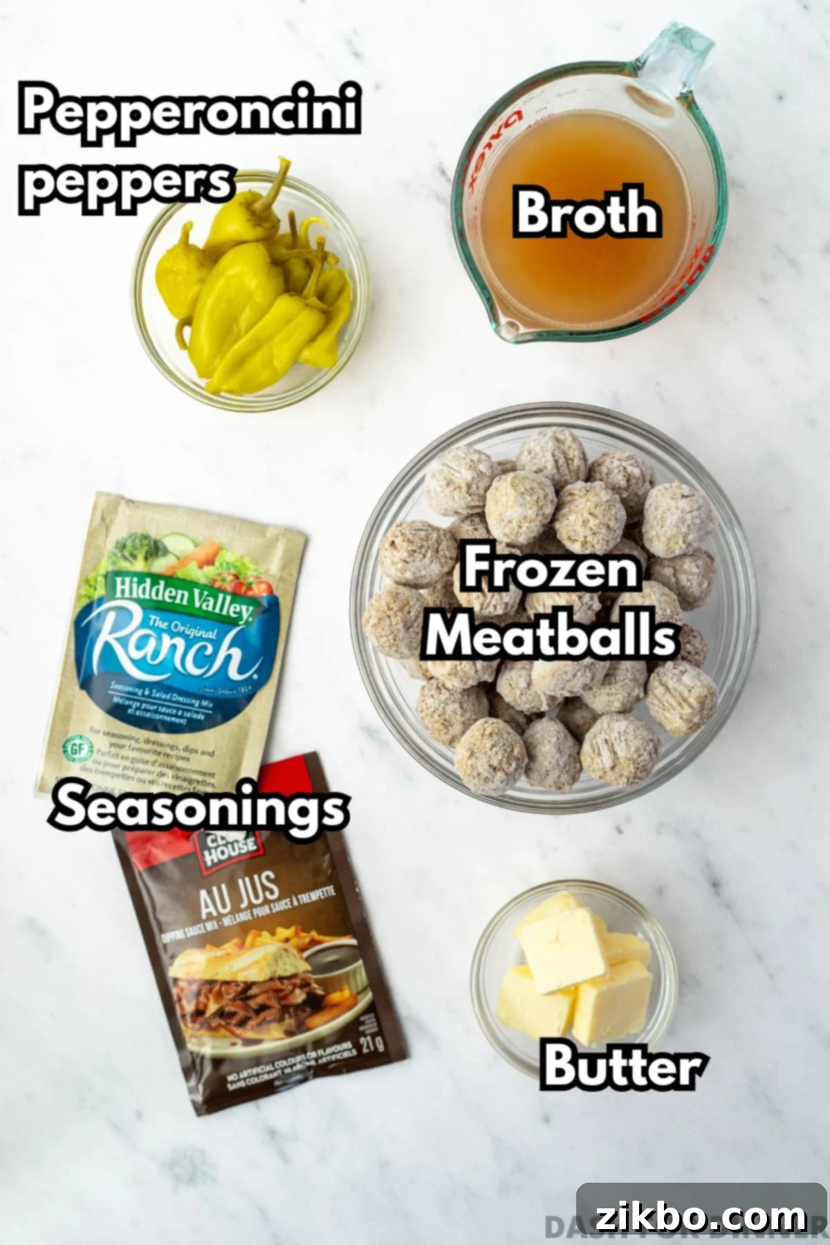 The ingredients needed to make mississippi meatballs, including frozen meatballs, ranch seasoning, butter, beef broth, and au jus seasoning.