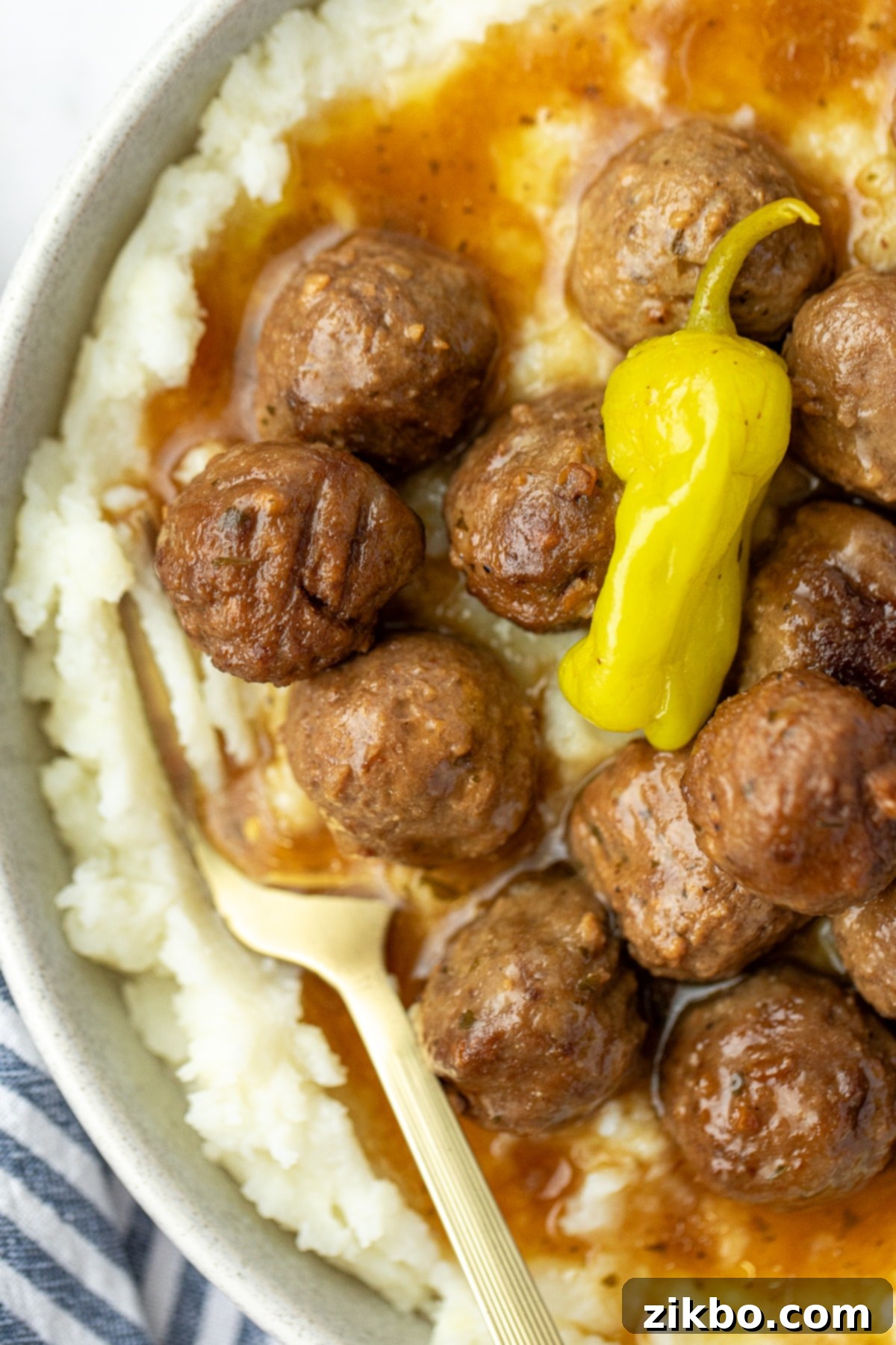 Creamy mashed potatoes topped with several Mississippi meatballs and a generous amount of the rich sauce.