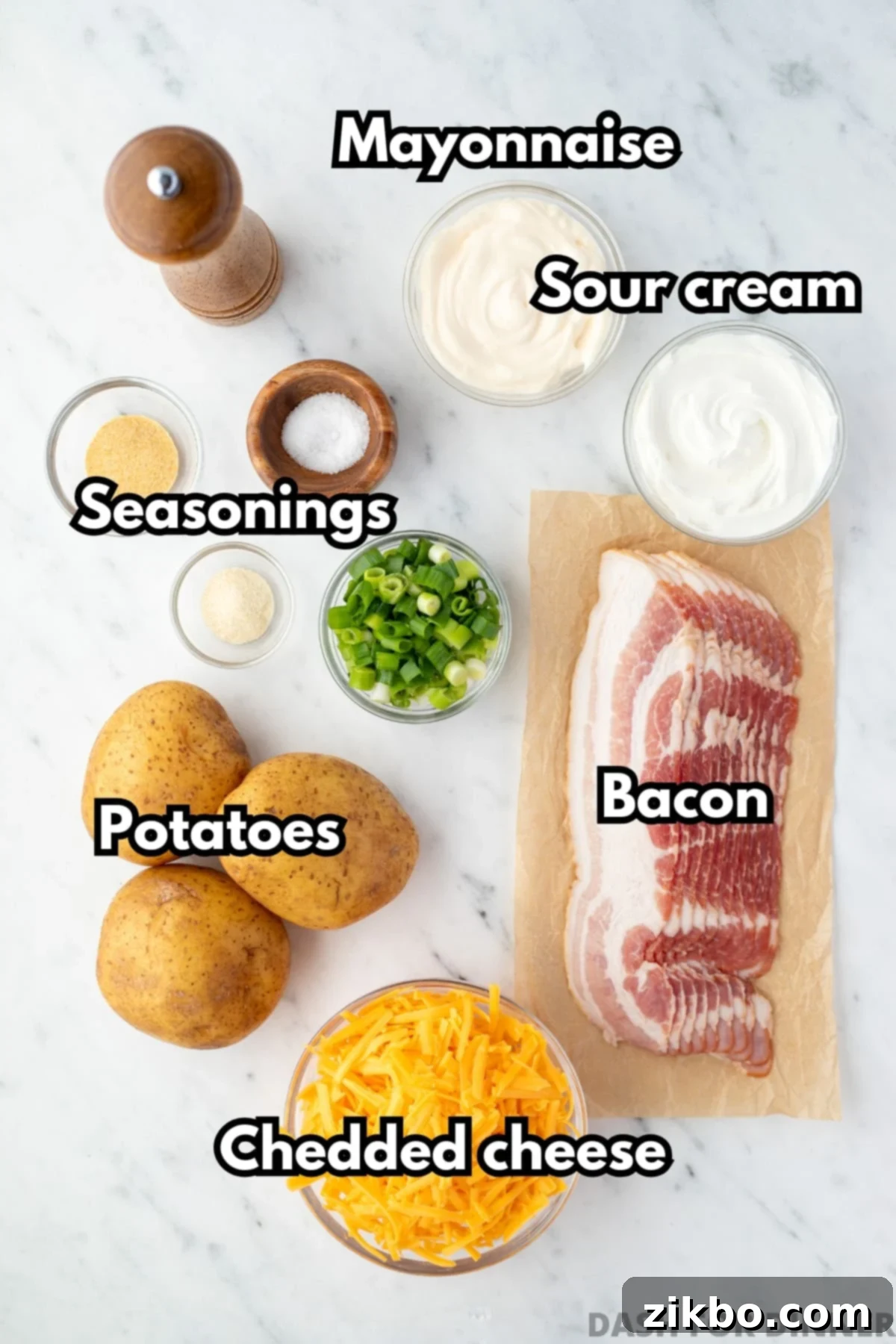 Mississippi Smothered Potatoes 3 The ingredients needed to make Mississippi Mud potatoes, including cheese, bacon, sour cream, and mayonnaise.