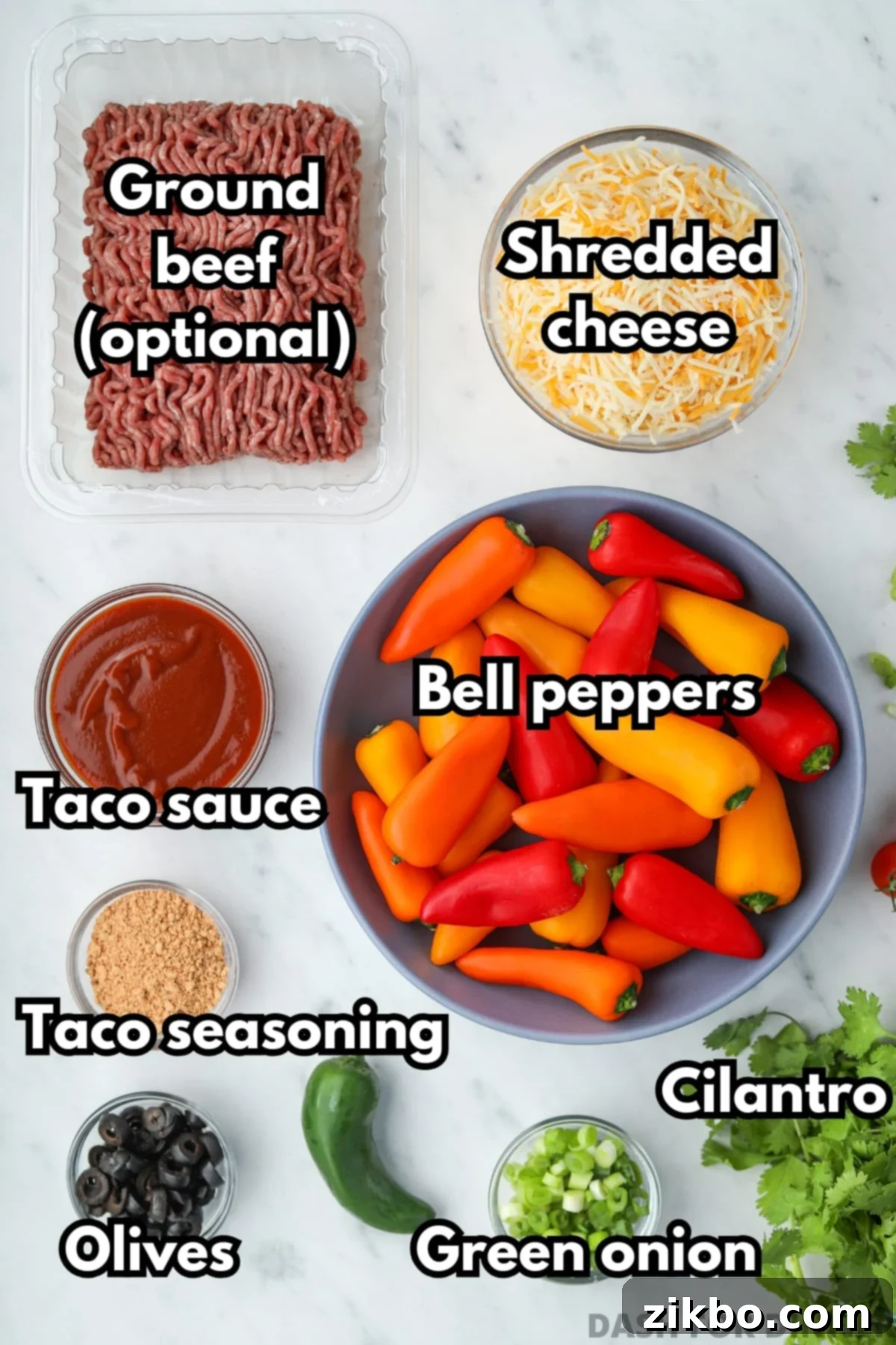 The ingredients needed to make bell pepper nachos, including cheese, taco seasoning, cilantro, and jalapeno.