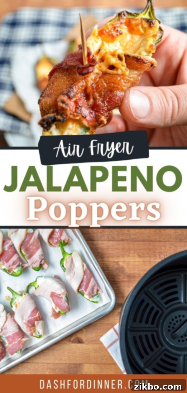 A hand reaching into an air fryer basket to grab a perfectly cooked, golden-brown bacon-wrapped jalapeno popper, with more poppers visible in the background.