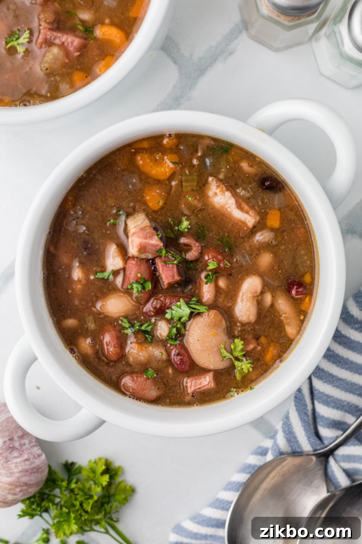 15 Bean Soup 2 A bowl of bean soup filled with bits of ham, ready to be enjoyed.