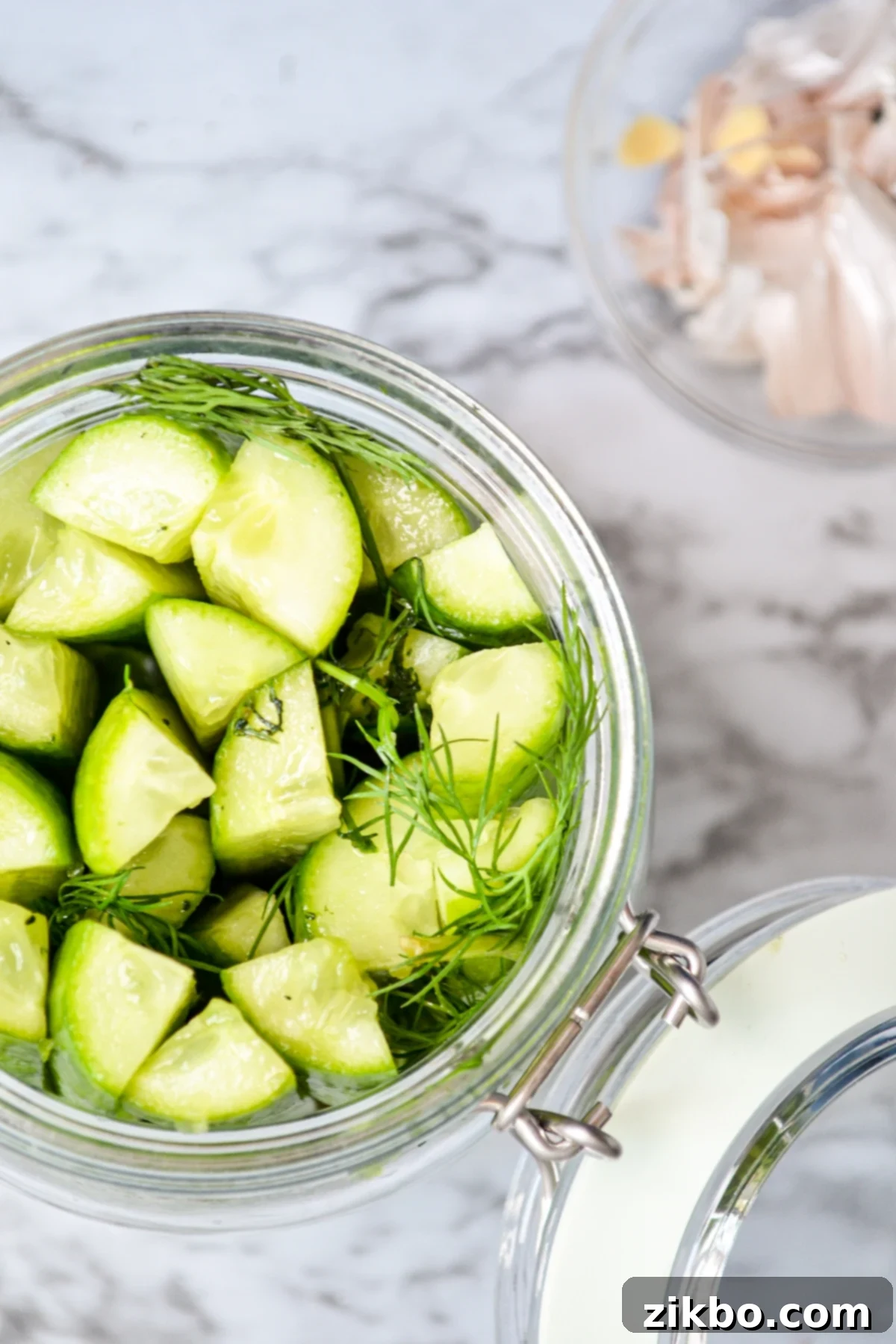 Instant Pot Fast Pickles 5 A jar of refrigerator pickles in a glass jar, showing off the perfectly cut spears and fresh dill.