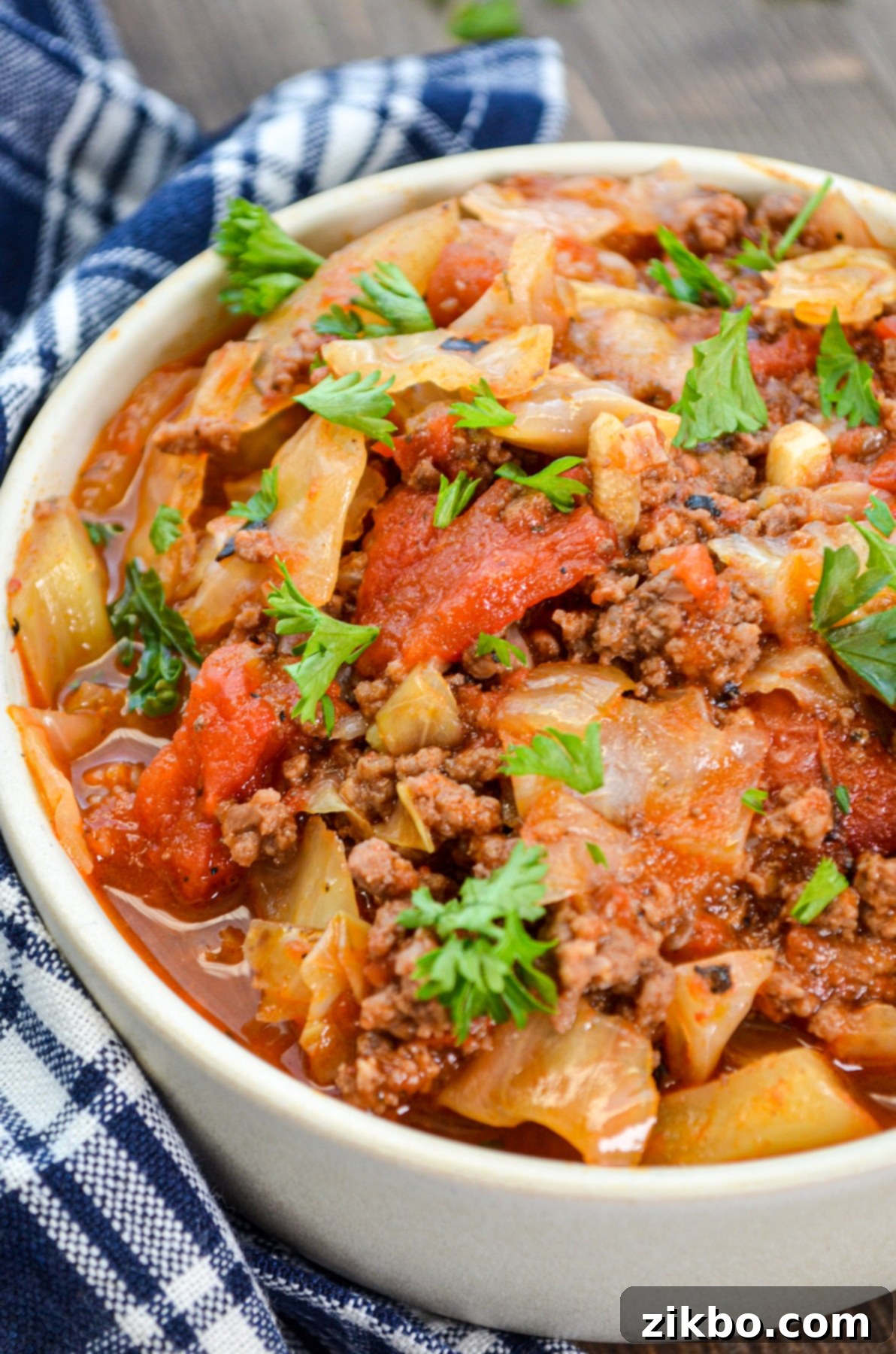 A close up of a bowl of unstuffed cabbage rolls.