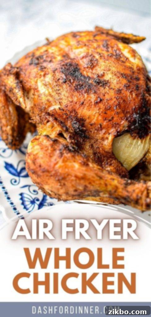A beautifully roasted whole chicken, carved and presented on an ornate blue and white plate.