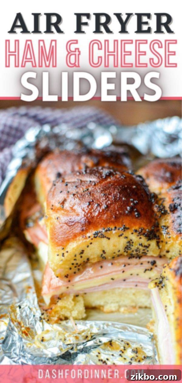 Golden Air Fryer Ham and Cheese Sliders 9 A vibrant hero shot of baked ham and cheese sliders in foil with a text overlay 'Air Fryer Ham and Cheese Sliders'.